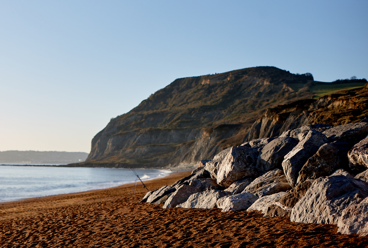 mountains next to a beach