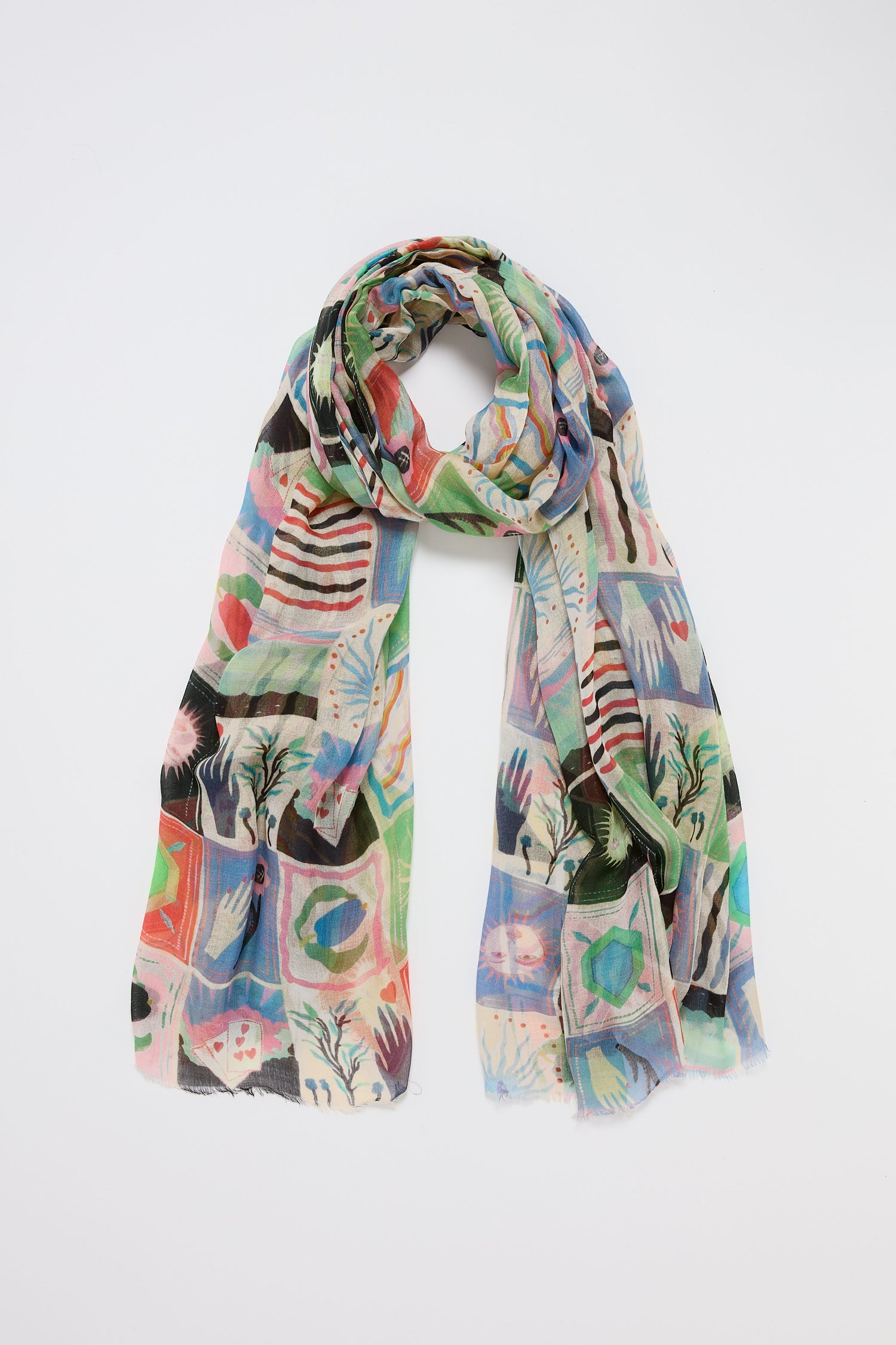 The Mystical Collage Scarf adds vibrant charm to any outfit with its colorful abstract pattern of stripes, blocks, and shapes on white—a storytelling print designed to stand out.