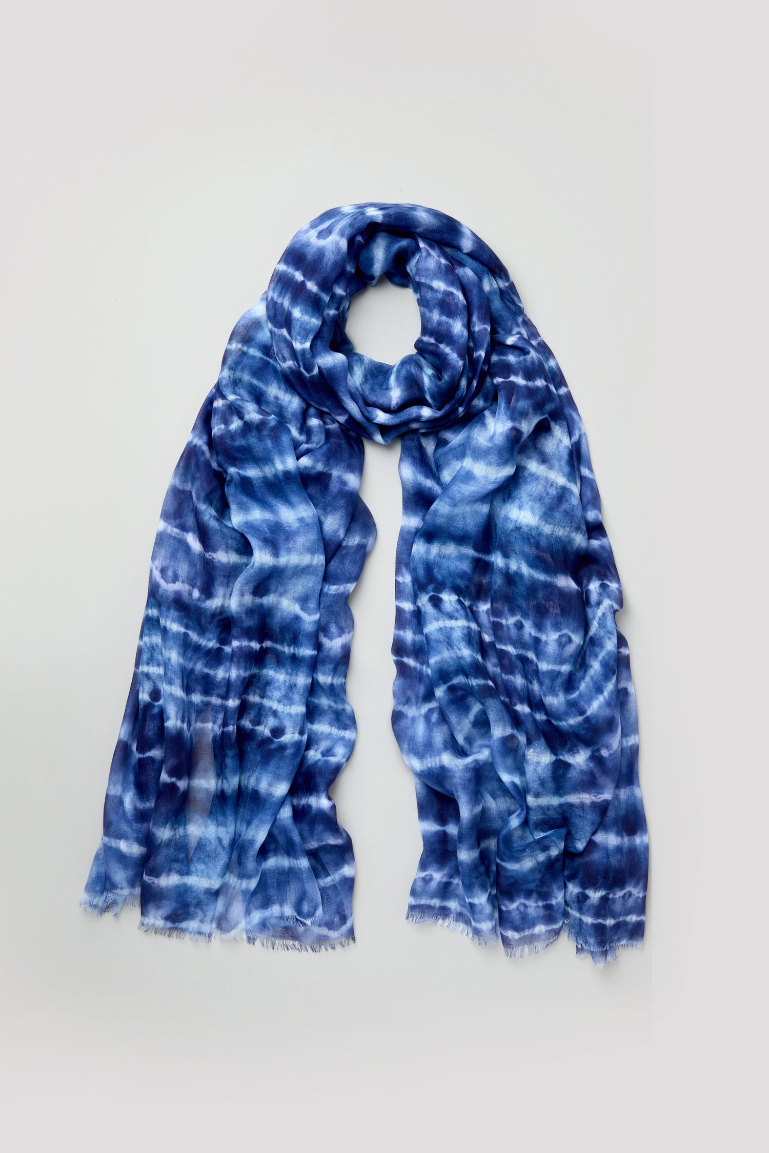Tie Dye Print Scarf in blue and white modal silk with fringed edges, displayed flat on a plain light background.