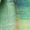 A close-up of turquoise and green abstract brush strokes on the Colour Blend Circle Print Scarf, reminiscent of a watercolor-inspired design, creates a textured and layered appearance.