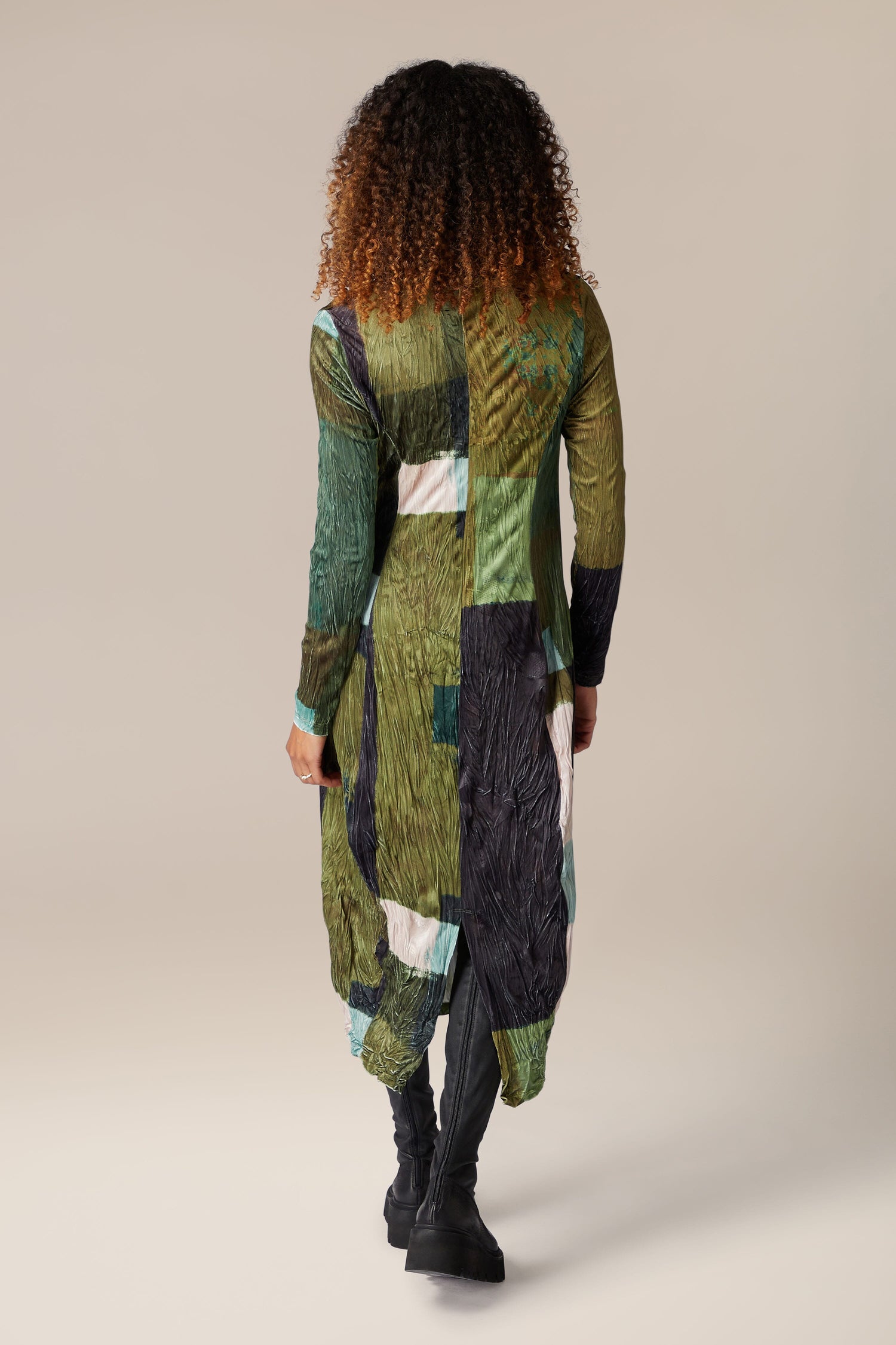 The back view of a woman wearing a Block Velvet Dress.