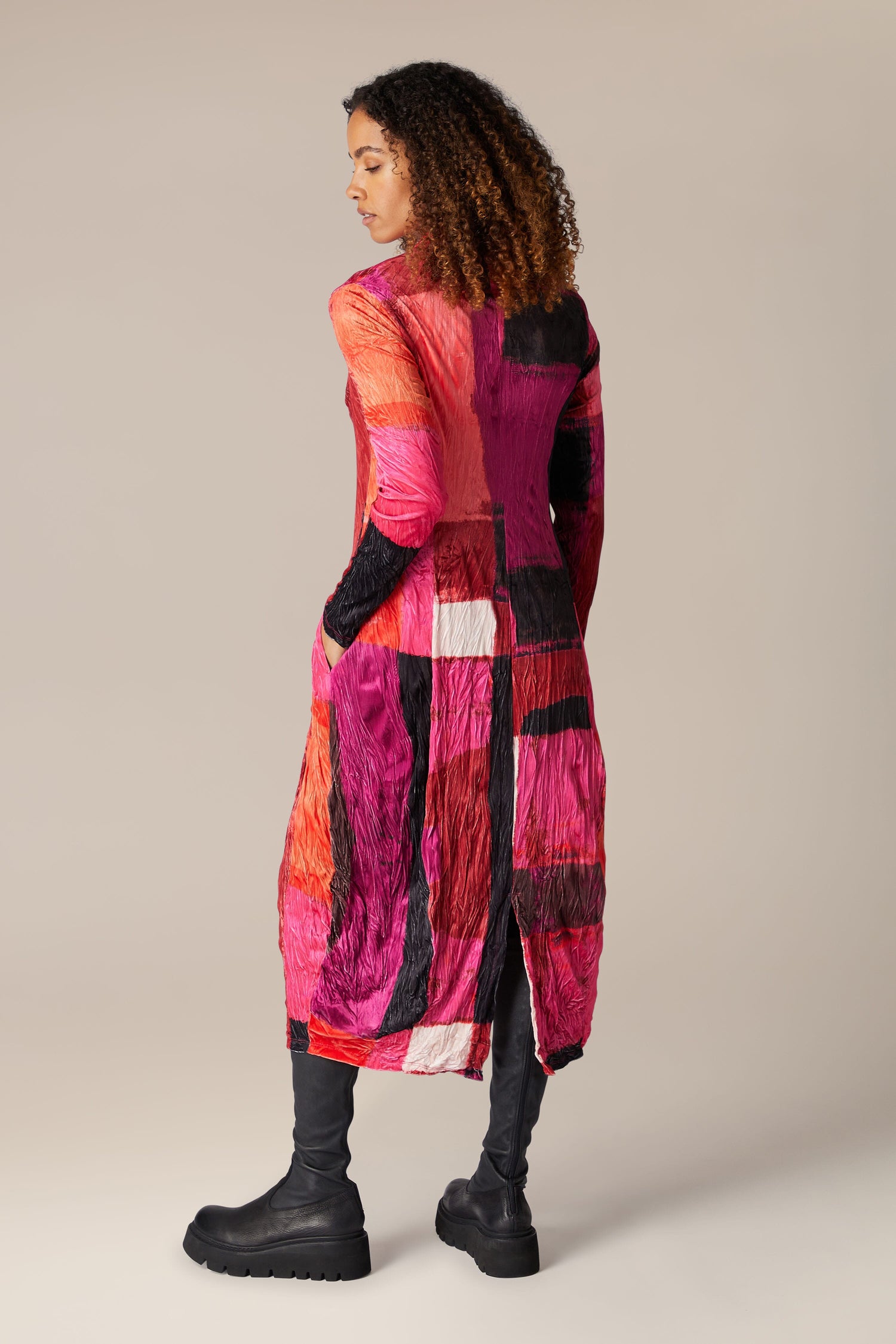 The back view of a woman wearing a Block Velvet Dress.