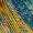 Close-up of the Artistry Pleat Scarf, featuring intricate yellow and blue woven patterns and textures—perfect as a lightweight statement accessory for versatile styling.