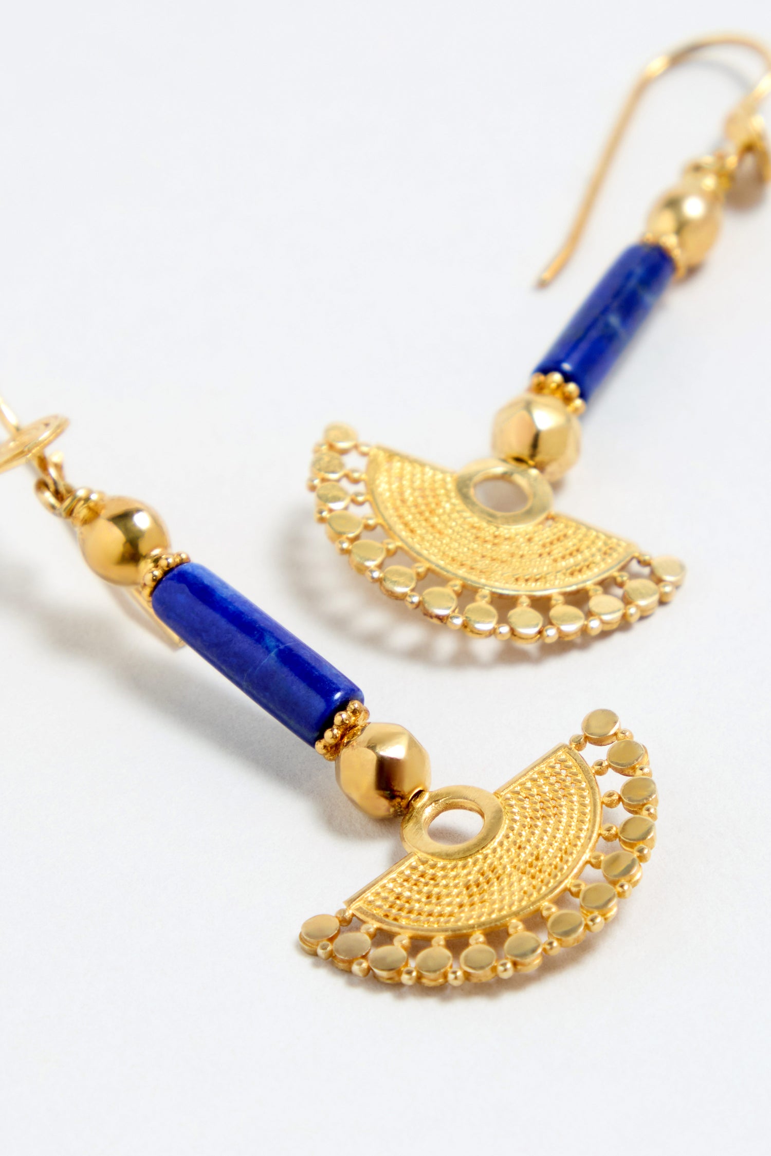 A pair of Gold Vermeil Lapis Fan Earrings, featuring blue cylindrical beads and semicircular filigree designs in gold vermeil, displayed on a white background.
