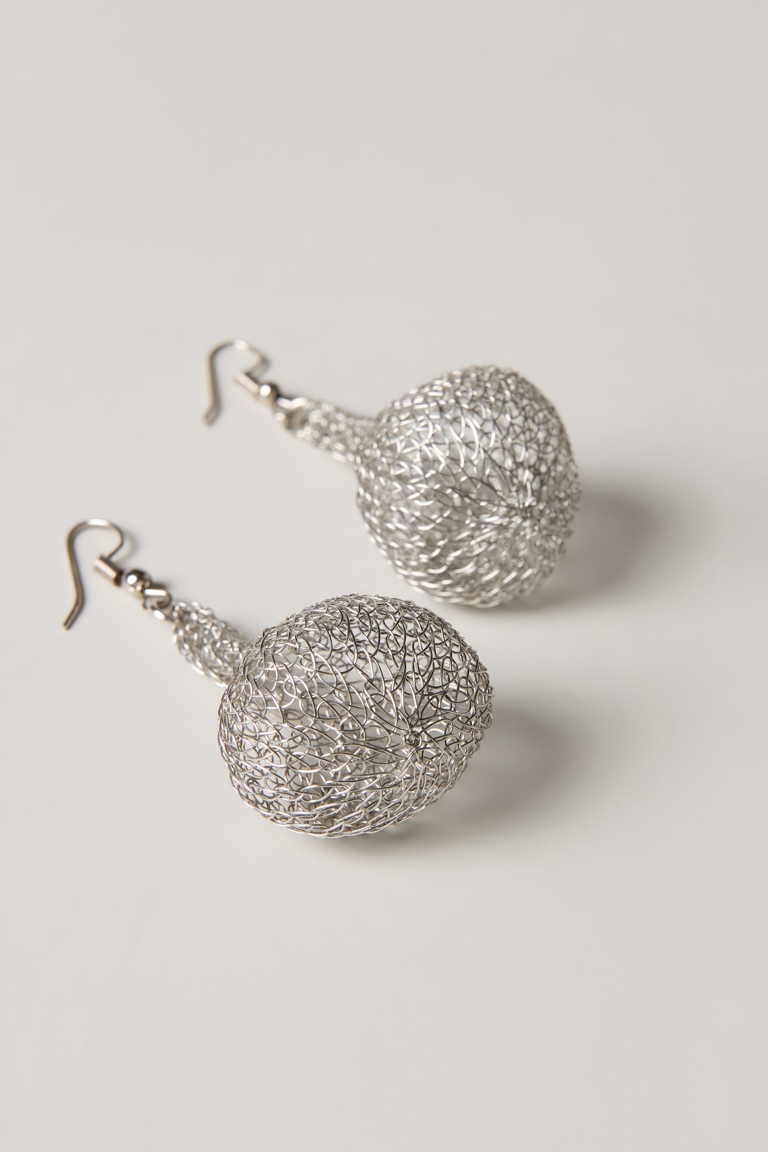 Hand Crocheted Teardrop Earrings with hook fastenings, featuring artisanal craftsmanship and a lightweight design, displayed on a plain light surface.