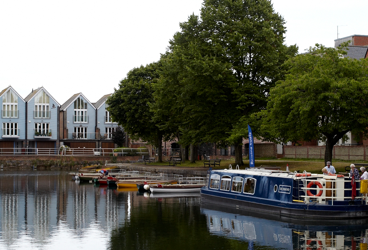 rowing boats and barges on a river