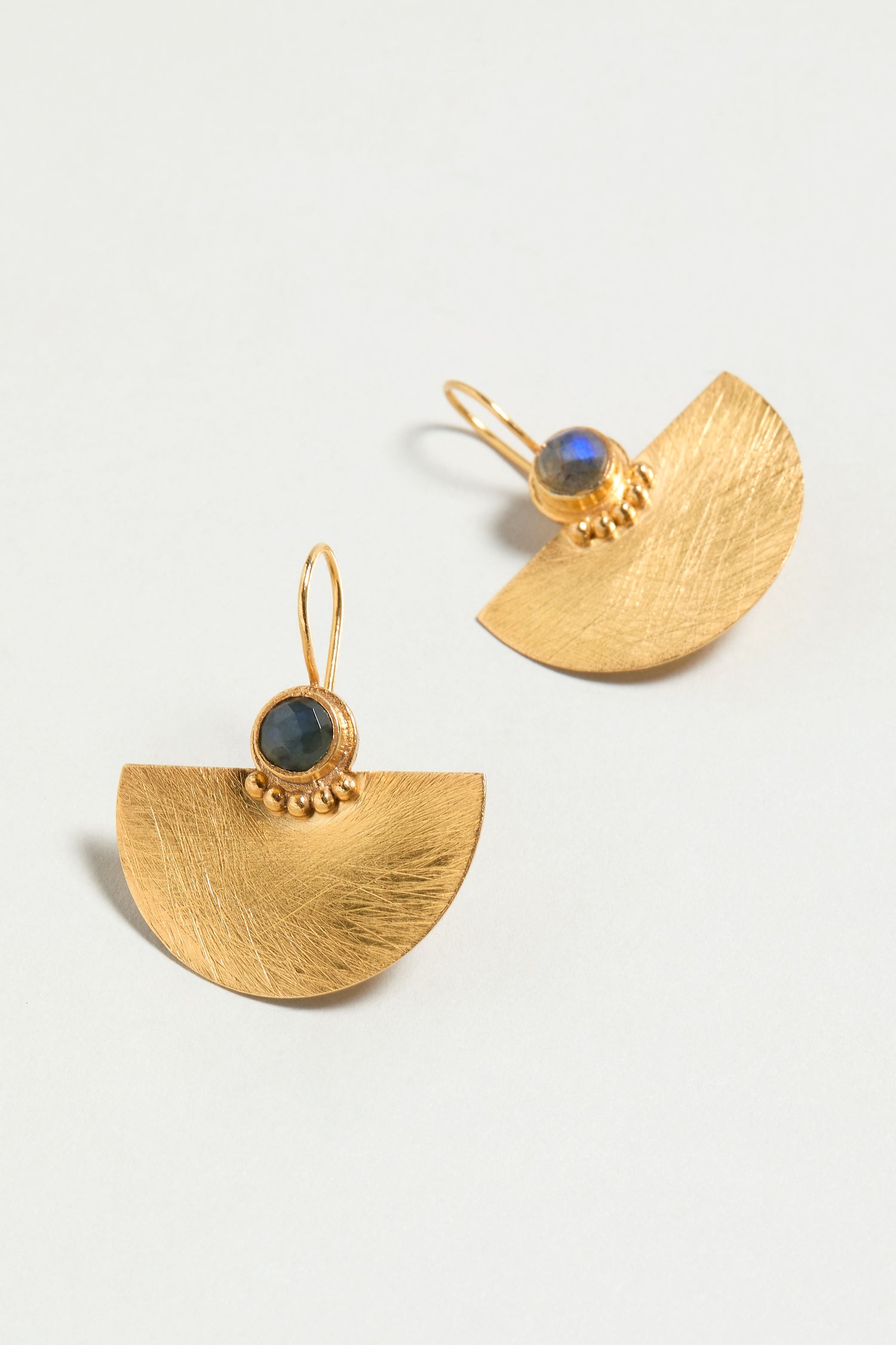 Introducing the Hand Crafted Gold Labradorite Fan Earrings, featuring gold half-circles with textured surfaces and round semi-precious labradorite stones set above delicate gold beads.