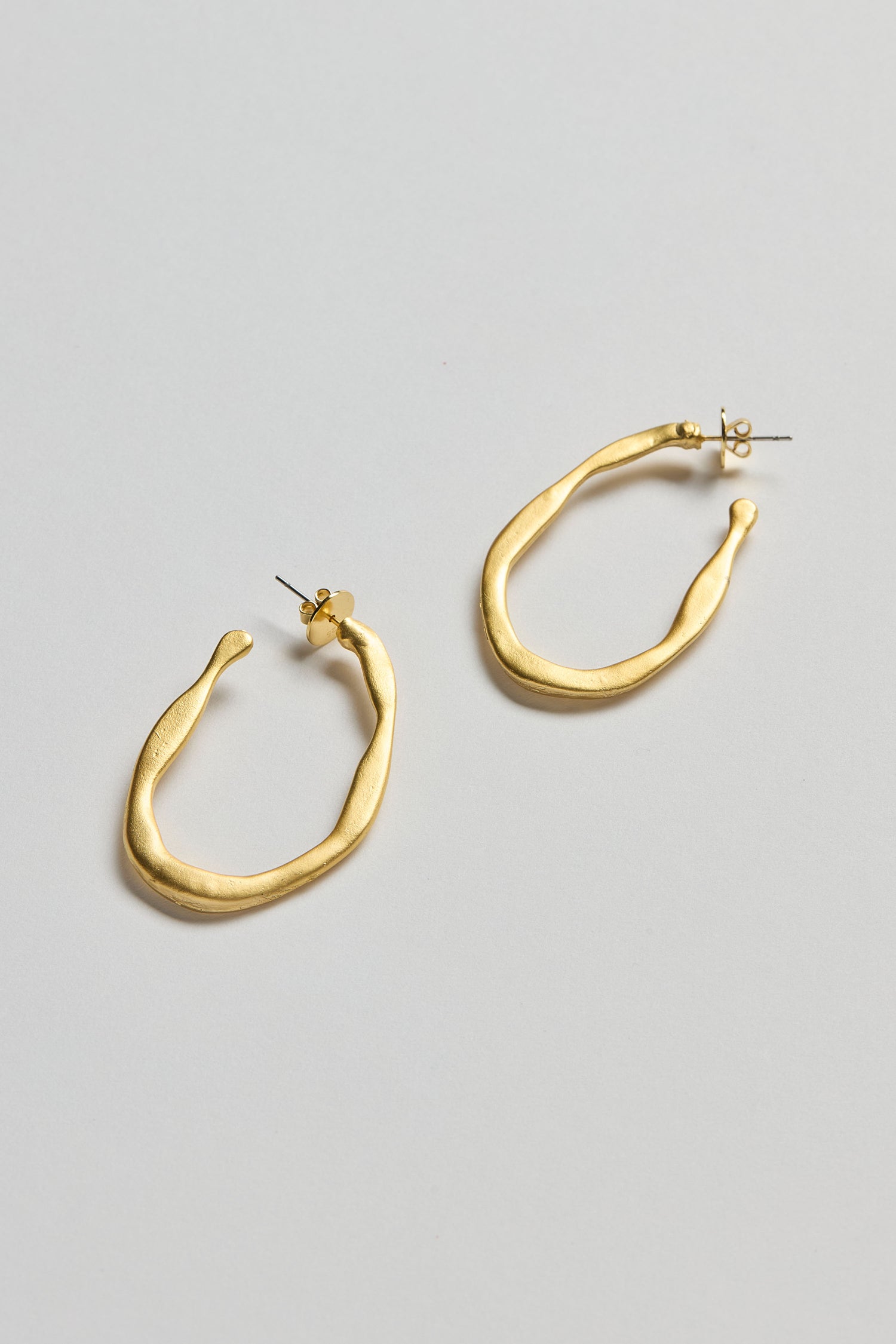 Gold Plated Crushed Hoop Earrings with post backings and a unique textured finish, shown on a white background—lightweight and ideal for effortless style.
