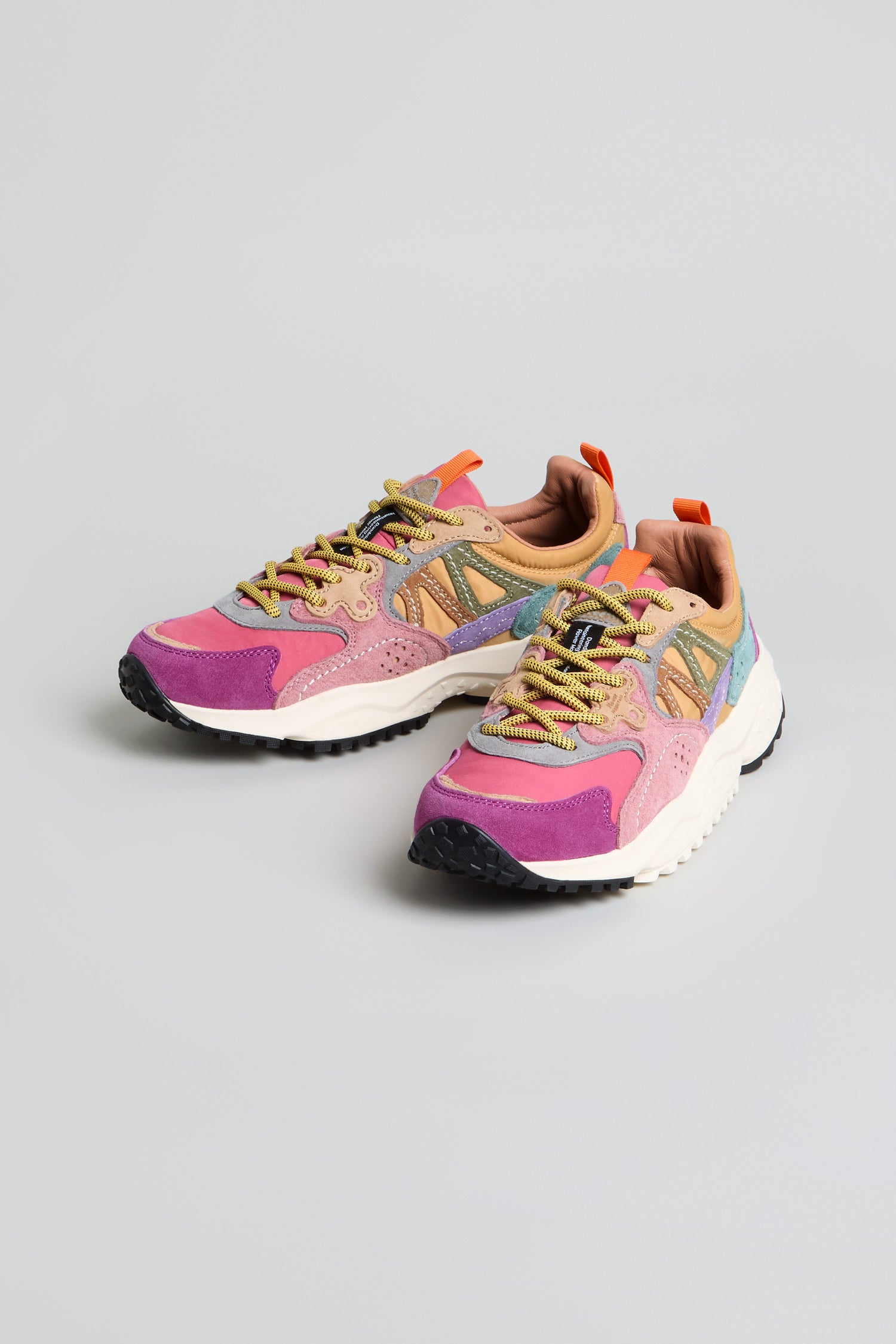 Introducing the Solin Colour Pop Trainers from Flower Mountain, crafted from suede and technical fabric in vibrant pink, purple, yellow, and beige accents on a light gray base. These trainers blend comfort and style effortlessly for a standout look.