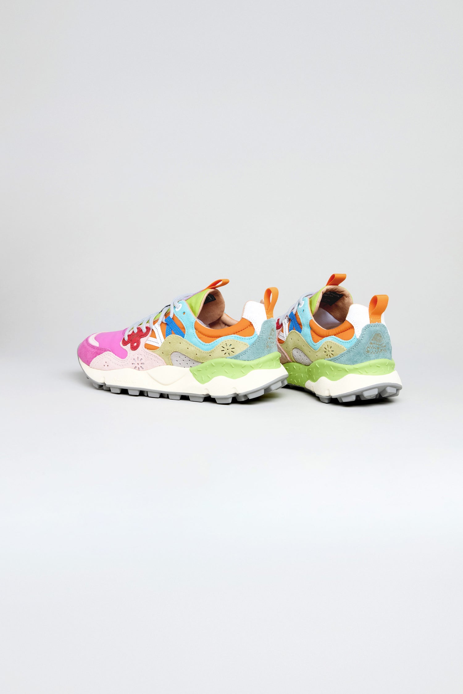The Fuchsia Yamano 3 Colour Pop Trainers are vibrant women's outdoor sneakers with pink, blue, green, yellow, and orange patterns on white—ideal for stylish trekking.