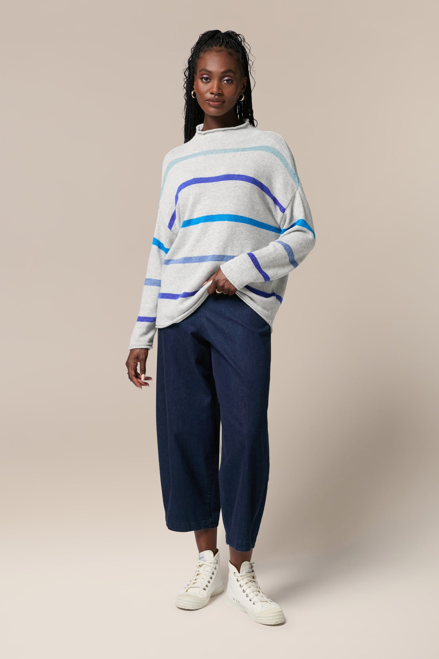 The model is wearing a Mohair Blend Stripe Sweater.