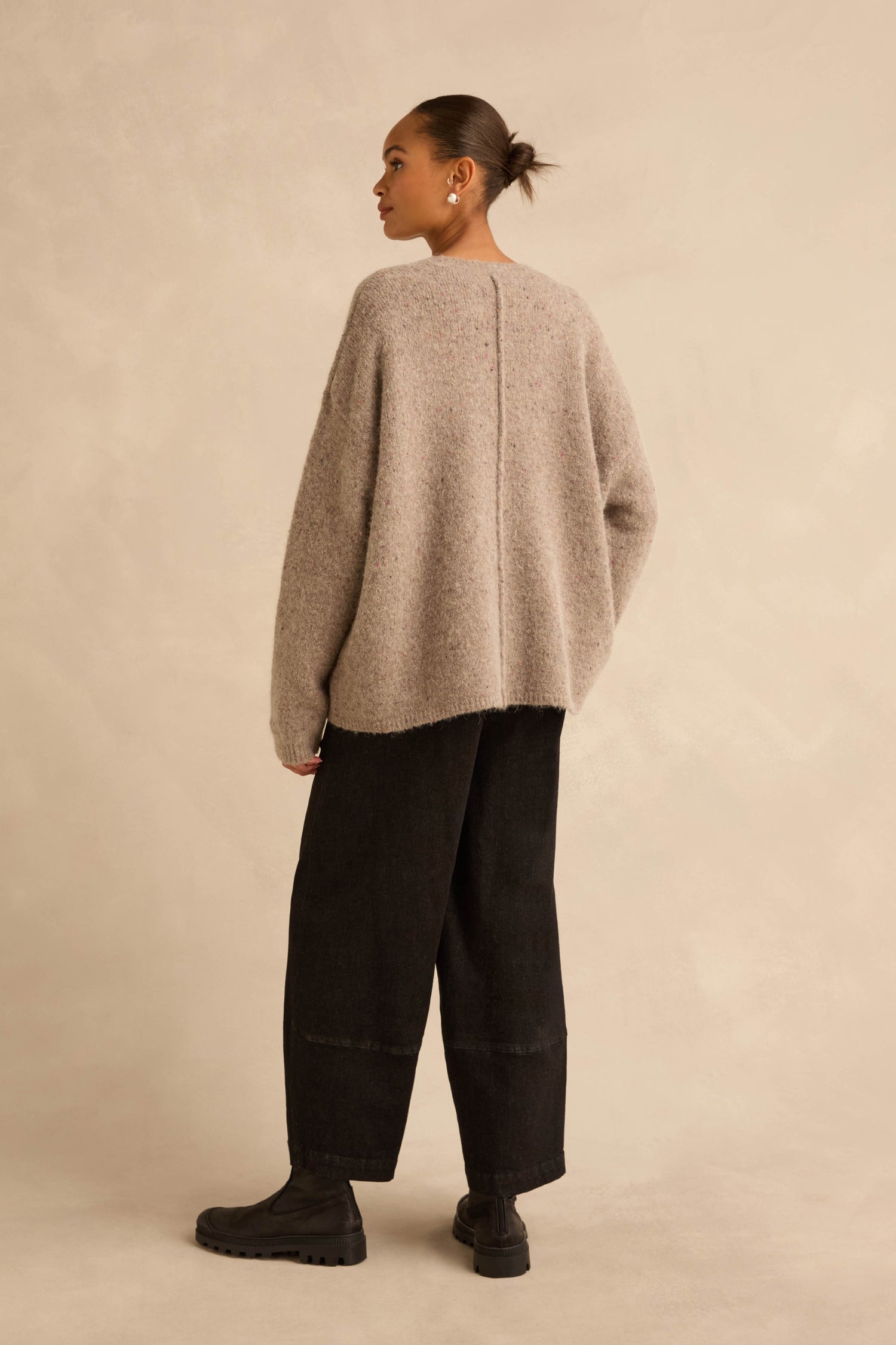Person wearing a Taupe Alpaca Blend Cropped Cardi with black wide-leg trousers and black lug-sole boots.