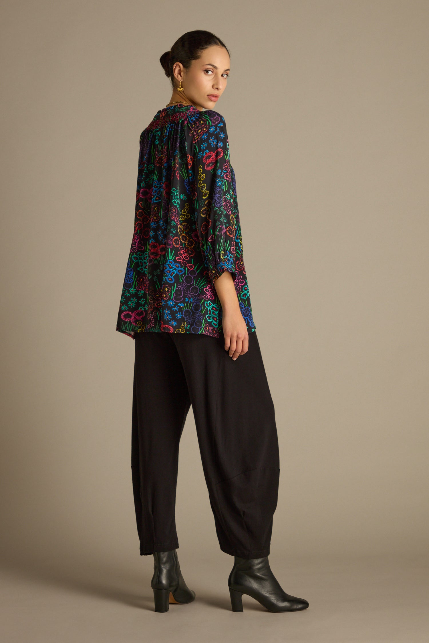 A person wearing a Floral Embroidery Print Shirt and black pants stands in a neutral pose against a plain background.