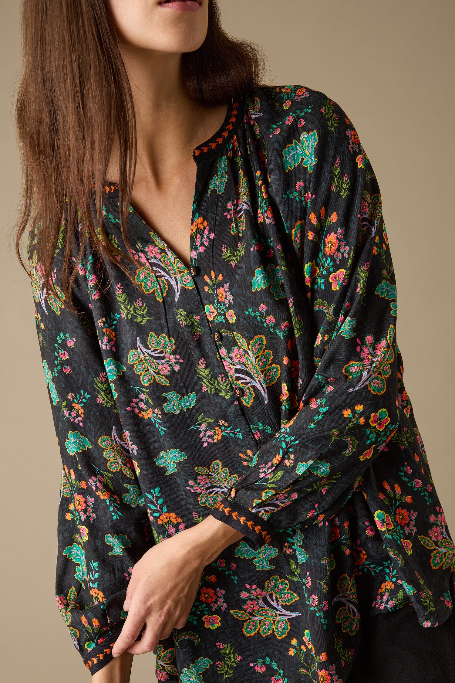 With ease, a person radiates style in the Hand Drawn Floral Boxy Shirt, set against a simple background.