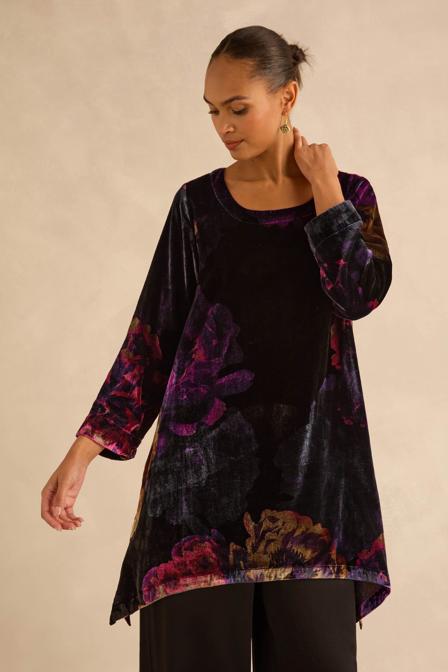 Midnight Peonies Velvet Tunic in black with purple, dark-toned floral prints, three-quarter length sleeves, and a fit-and-flare silhouette.