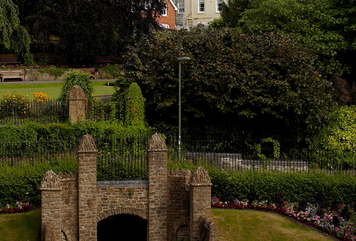 garden with a bridge over a river