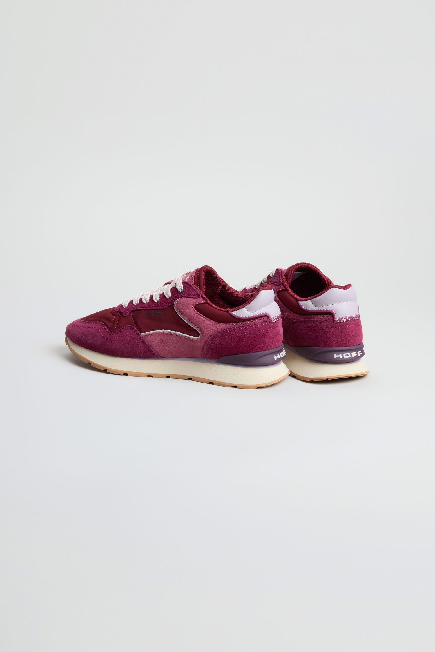 A pair of City Trainers in maroon and white premium suede with beige soles, showcased on a plain white background.