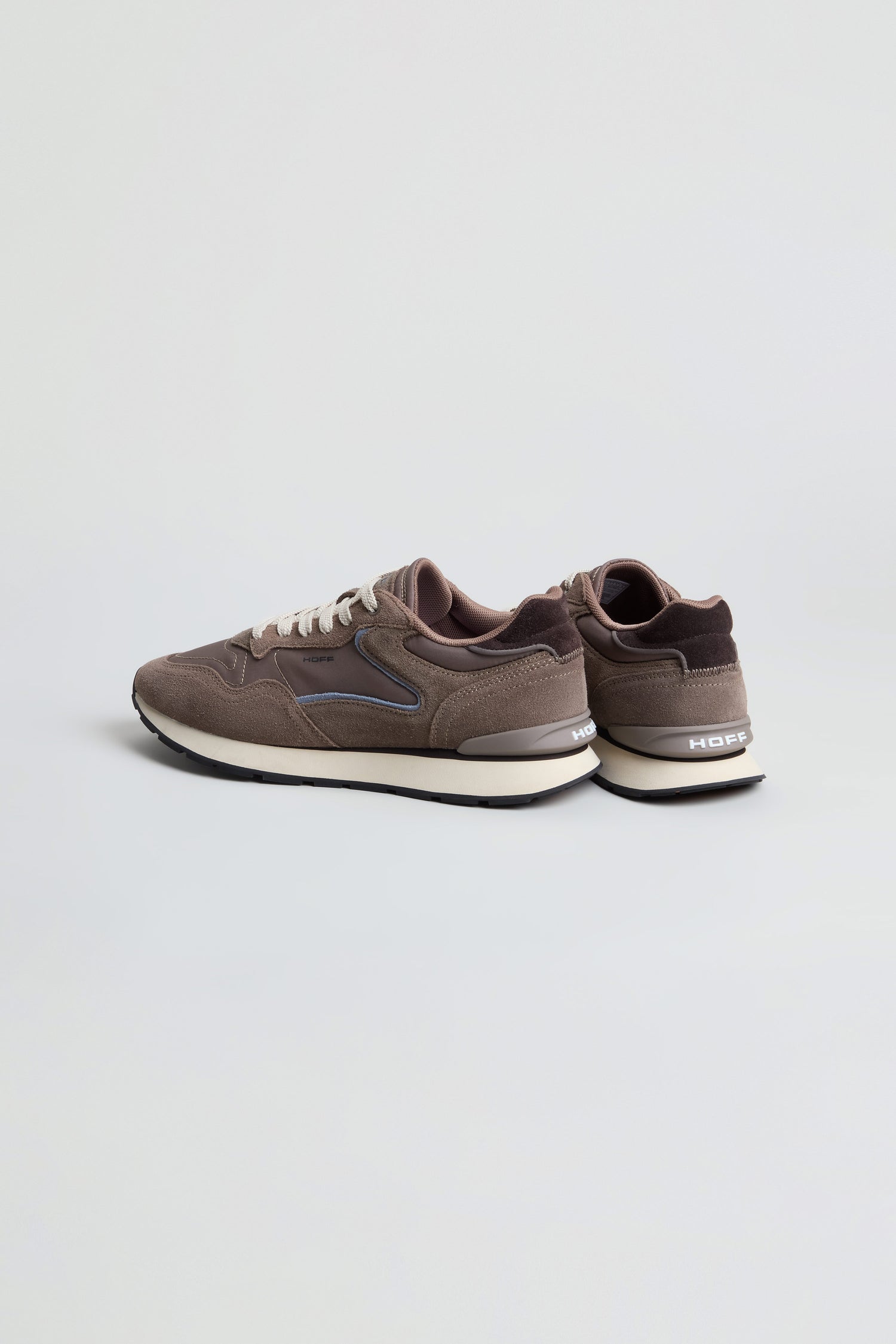 A pair of City Trainers in brown with white soles and laces, shown at an angle on a plain light gray background.