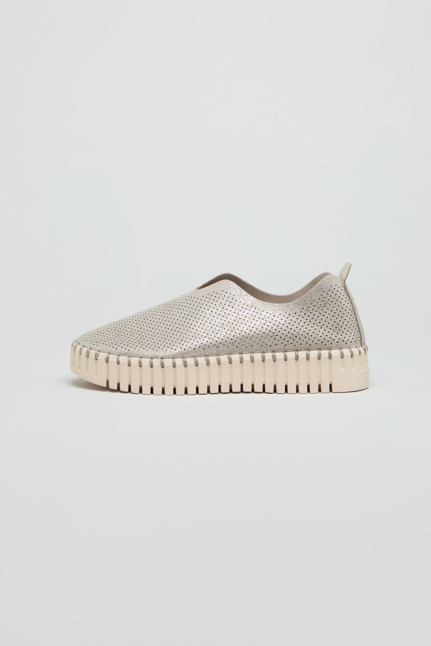 Tulip Glimmer Platform Slip on Shoes in beige feature a perforated upper and textured sole, shown in profile against a plain light background.
