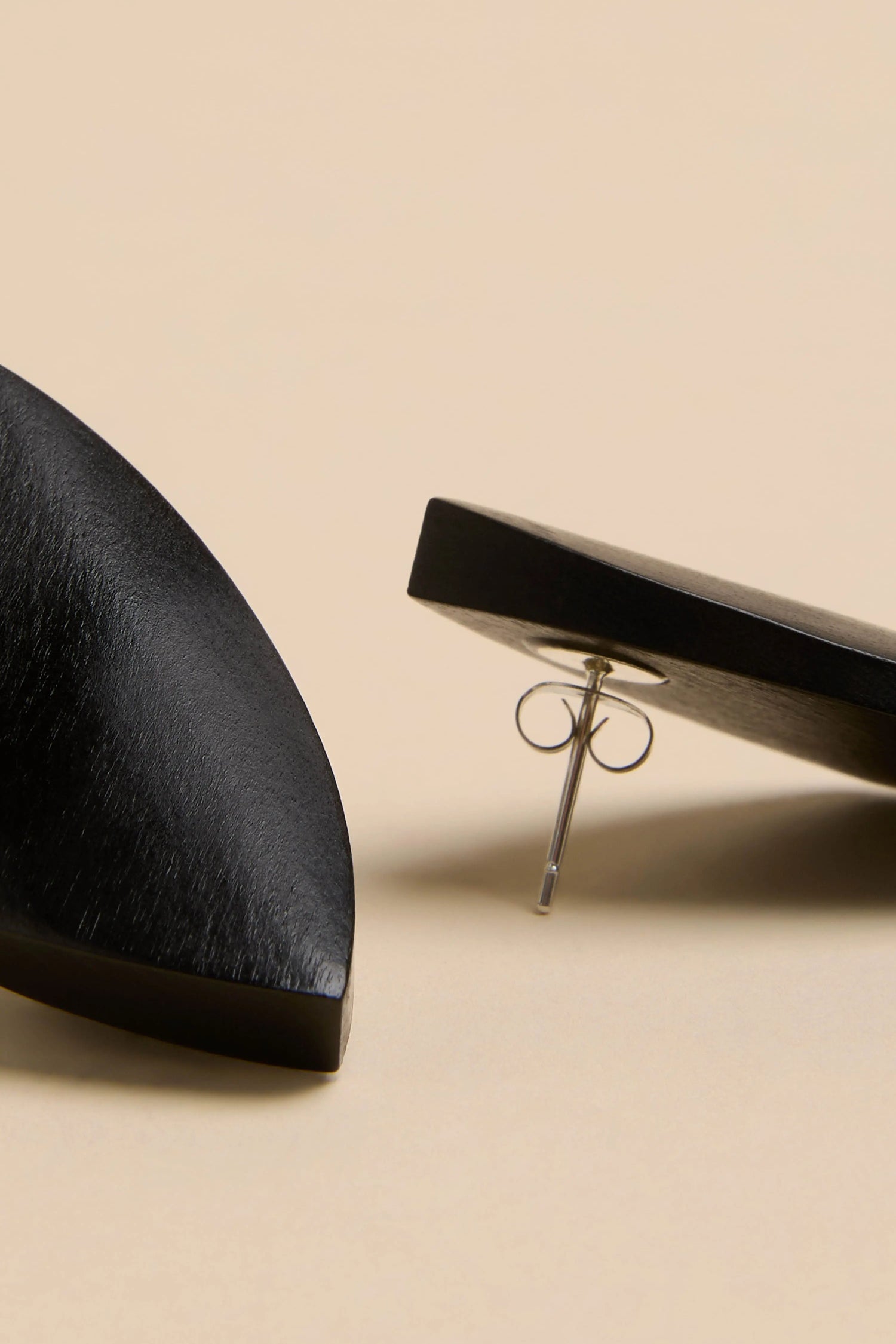 Sculptural Mango Black Wood Earrings made of black mango wood with metal earring backs.