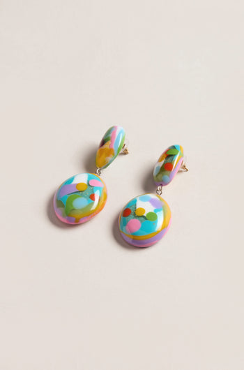The Kandinsky Duo Pebble Earrings feature round, colorful abstract designs with multicolored patterns on a light background, adding a playful, sculptural touch to any outfit.