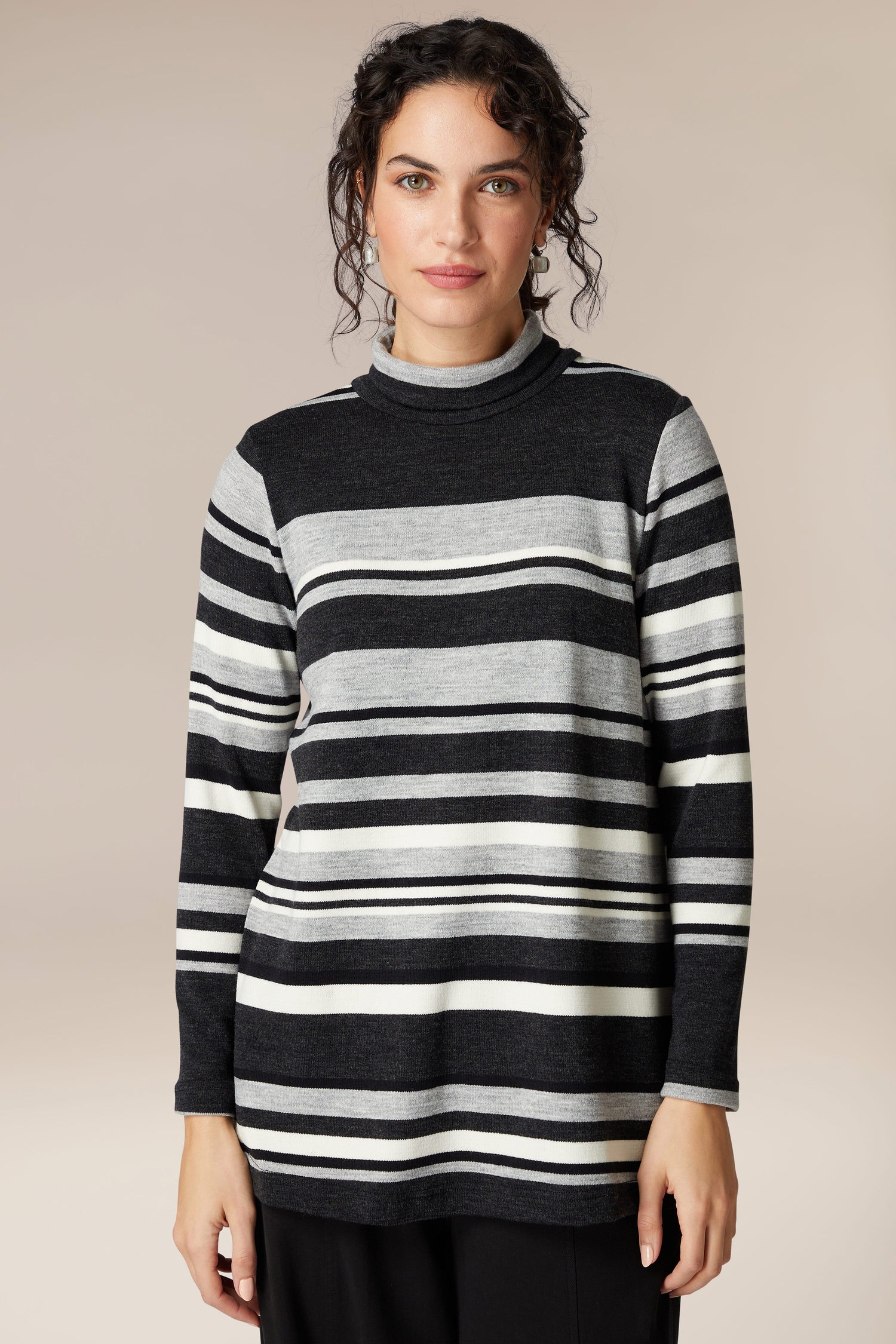 A woman exudes sophistication as she confidently wears a comfortable Jersey Stripe Knit Polo Top.