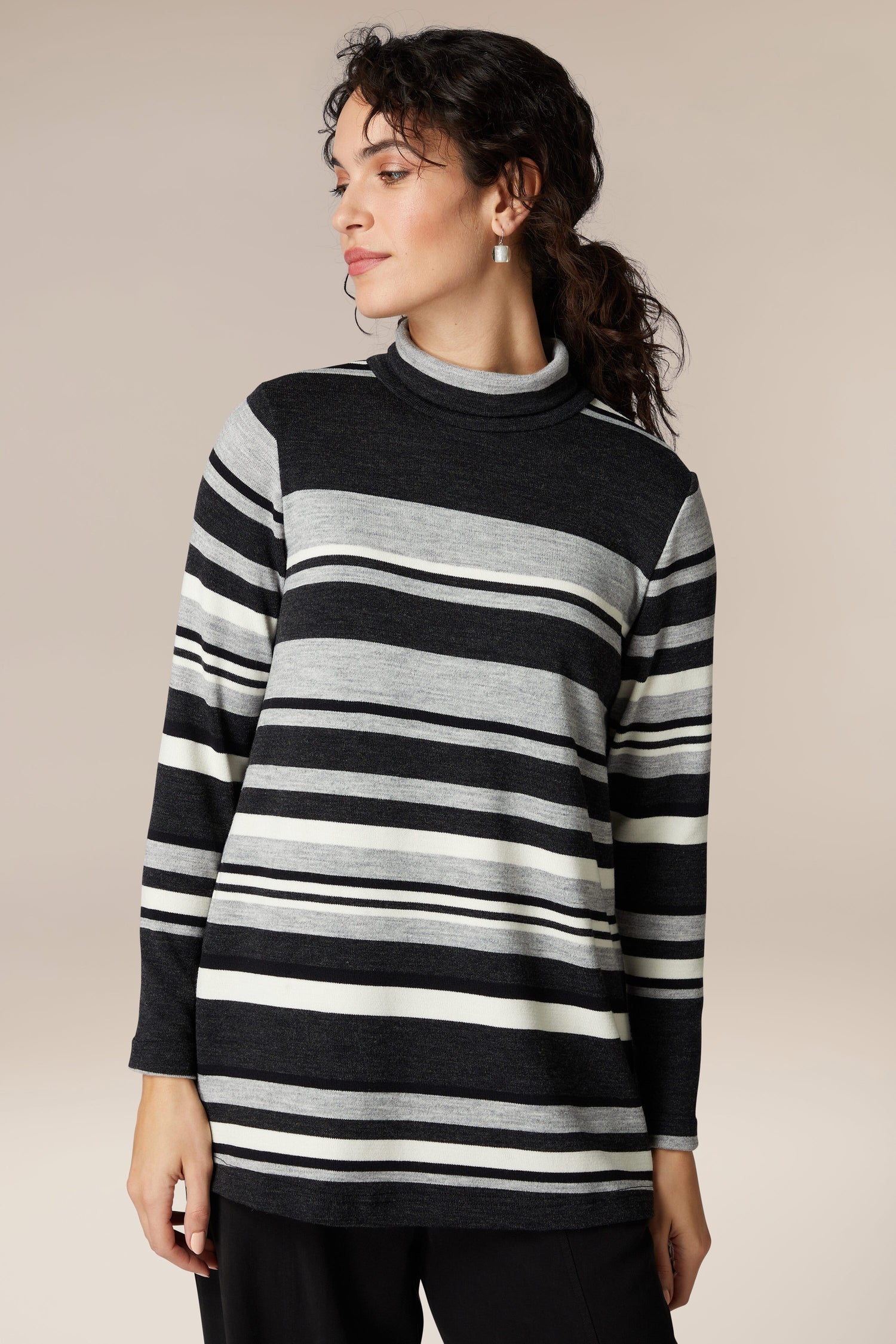 A woman exuding sophistication in her comfortable Jersey Stripe Knit Polo Top.