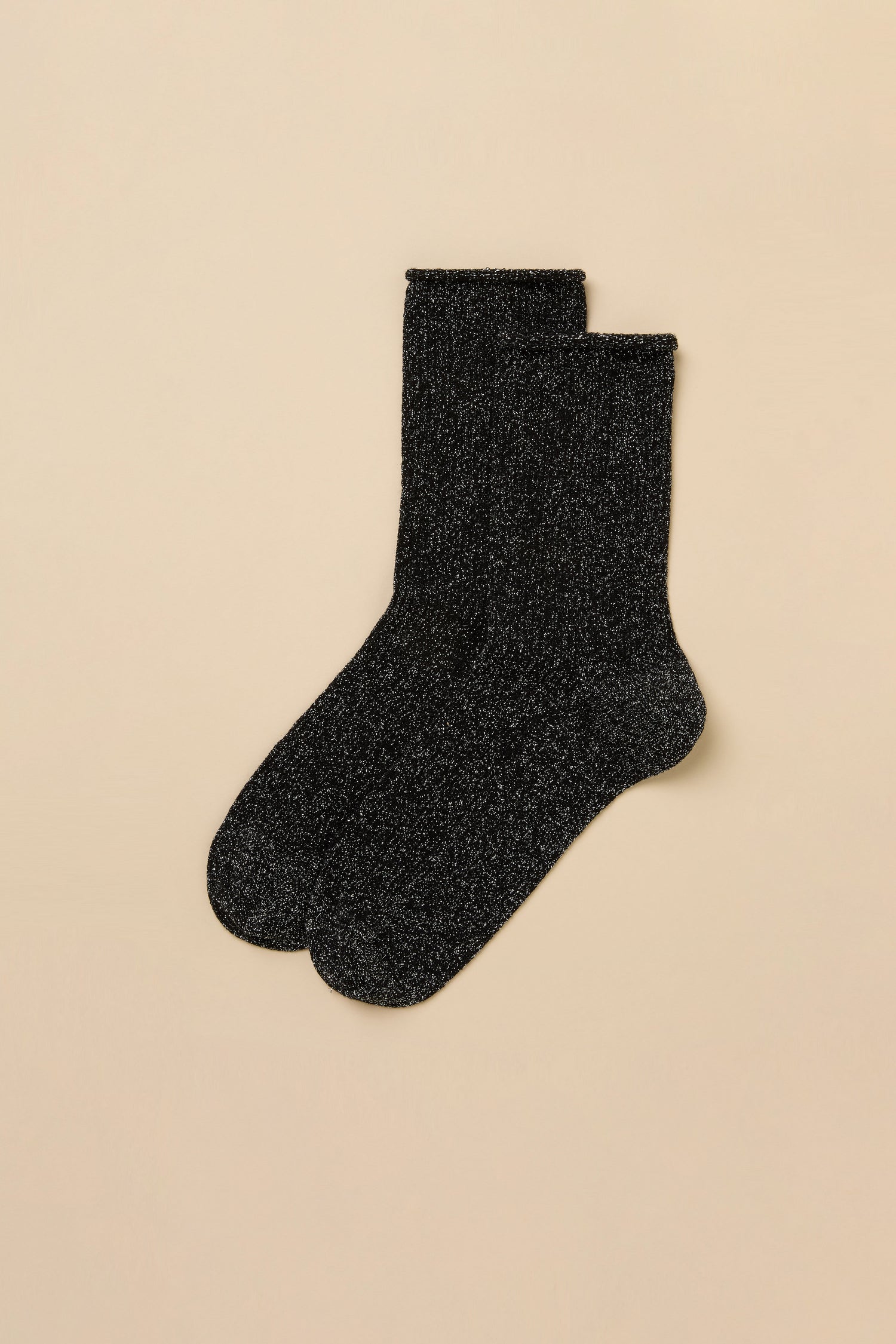 A pair of Black Bamboo Sparkle Socks made from a lyocell-blend knit with a subtle silver glitter finish.