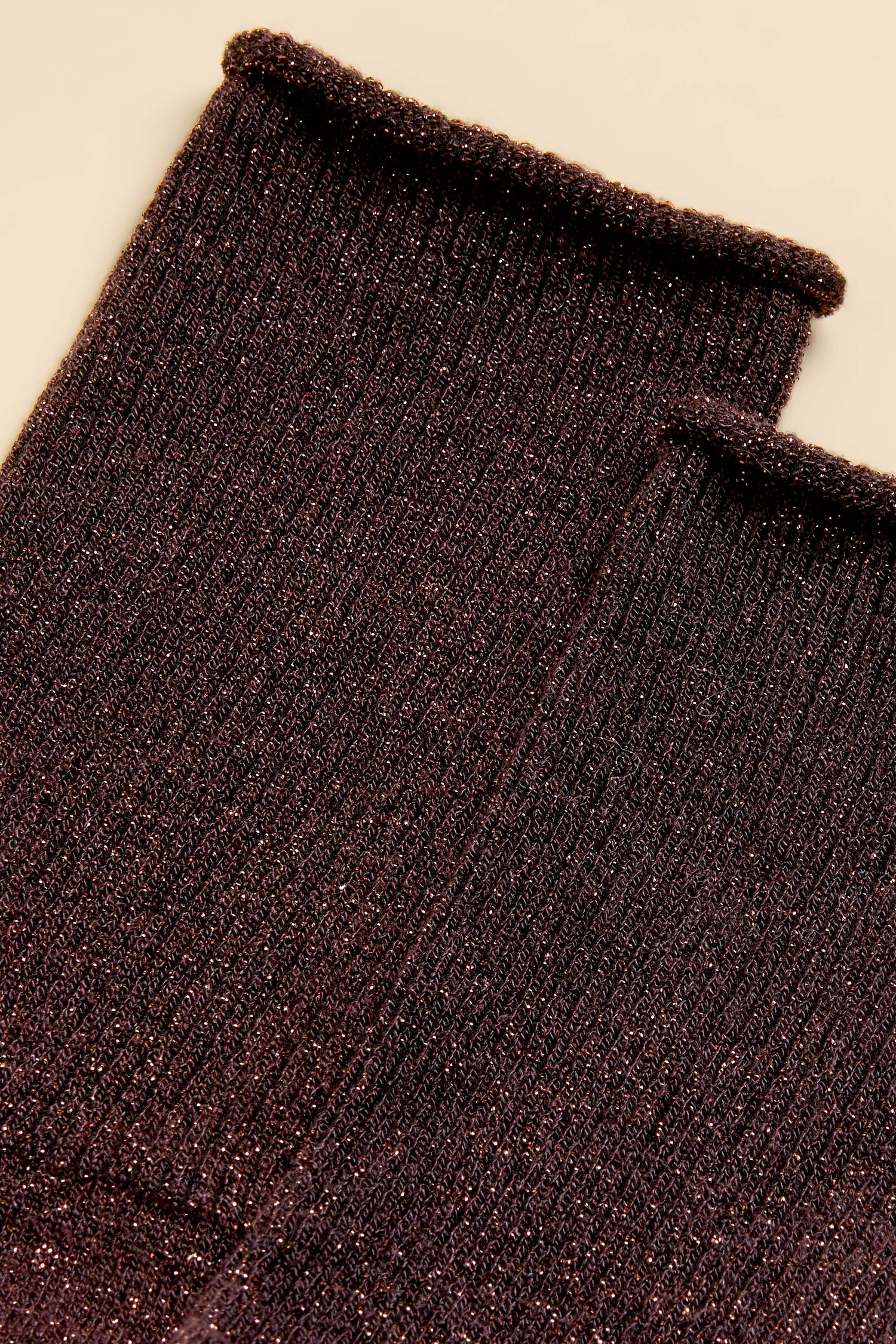 Close-up of two ribbed Dark Chocolate Bamboo Sparkle Socks with a subtle metallic thread woven into the dark brown knit.