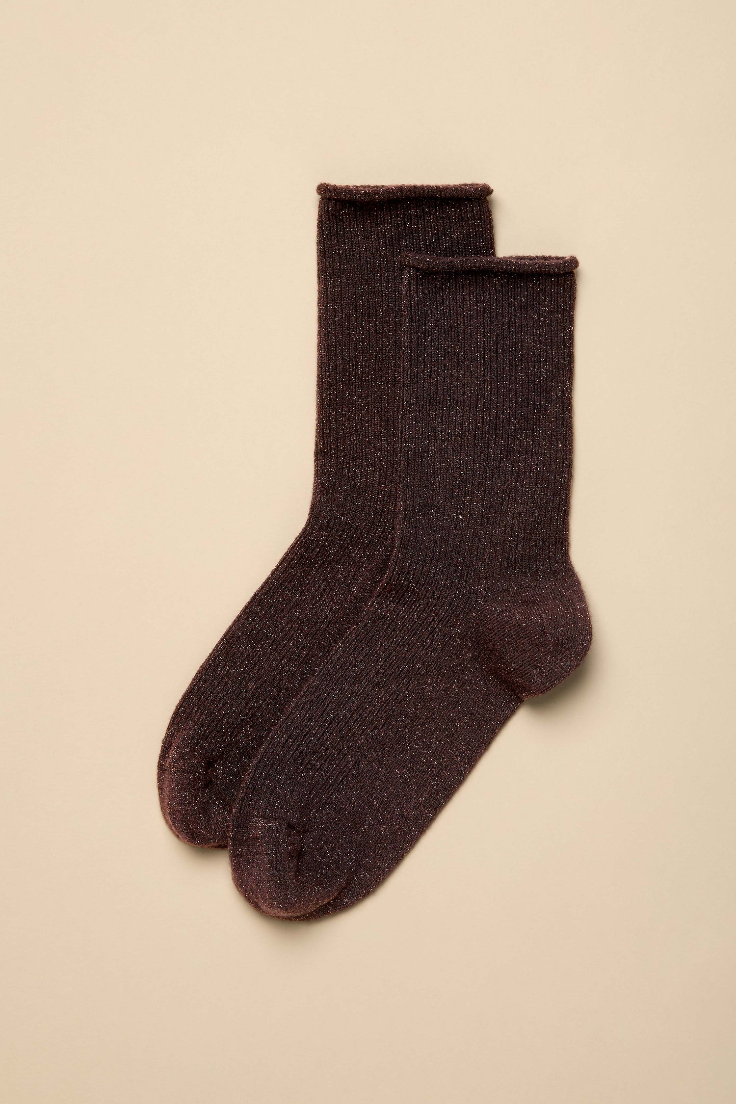 A pair of Dark Chocolate Bamboo Sparkle Socks, ribbed with a subtle glittery finish, laid flat on a light beige background.