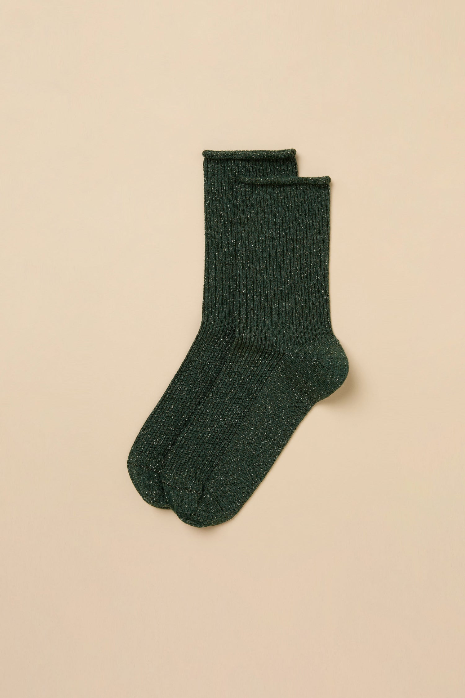 Pair of dark green Forest Bamboo Sparkle Socks in a lyocell-blend with a ribbed texture and subtle metallic flecks.