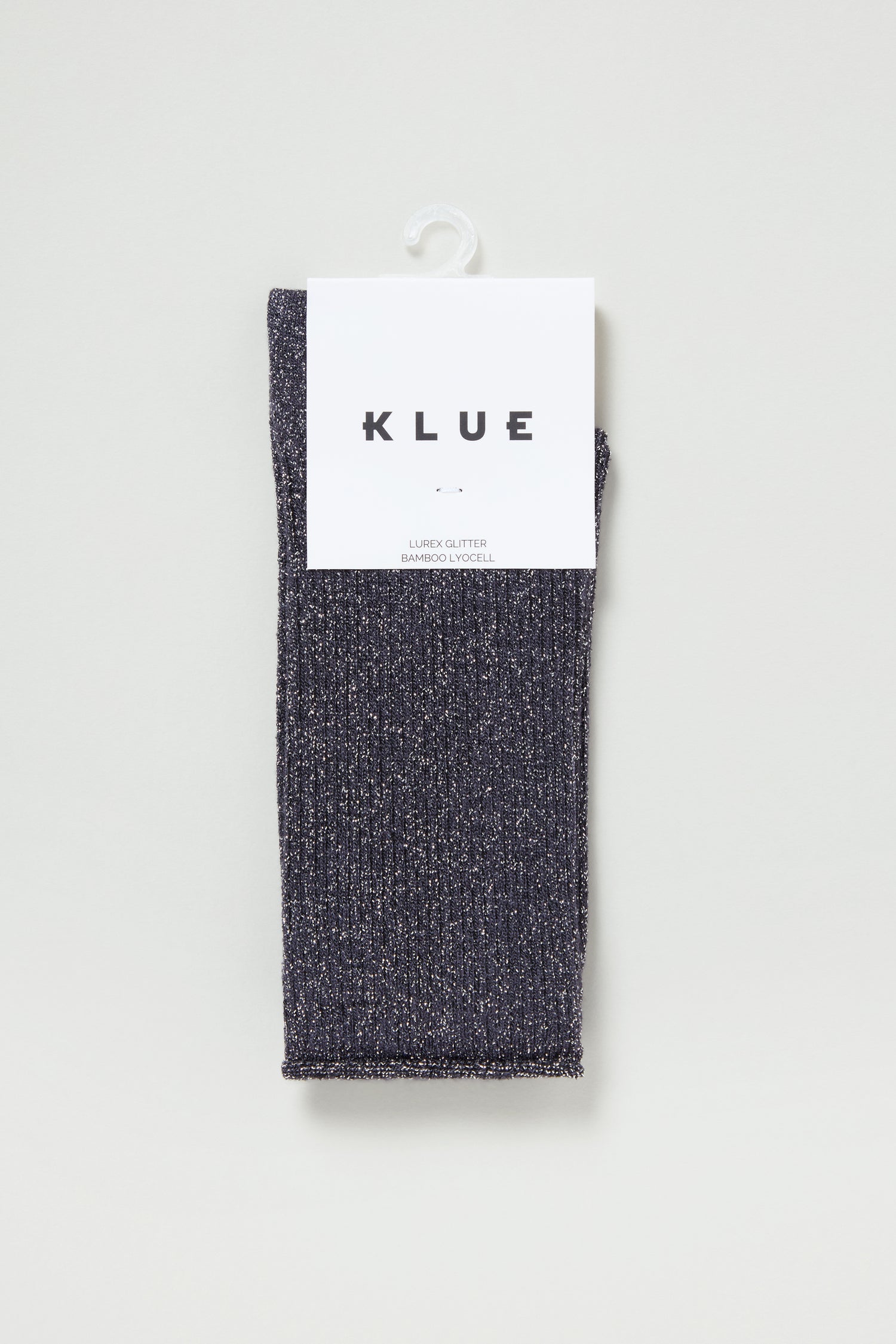 A folded pair of Bamboo Sparkle Dark Grey Socks, featuring a white "KLUE" label, is displayed against a plain light background.