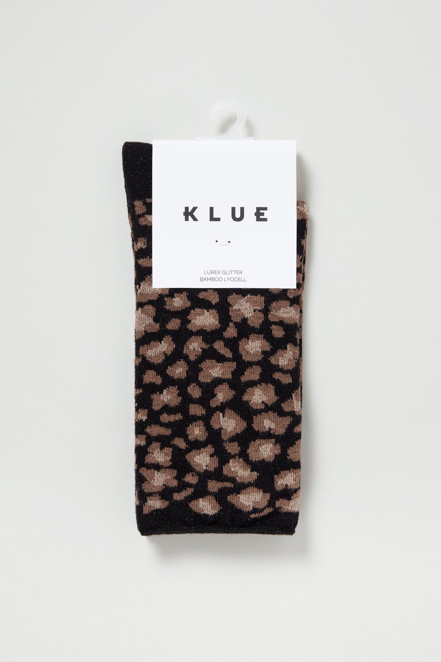 A pair of Bamboo Leopard Black Print Socks featuring a breathable design and stylish leopard pattern, packaged with a white "KLUE" brand label.
