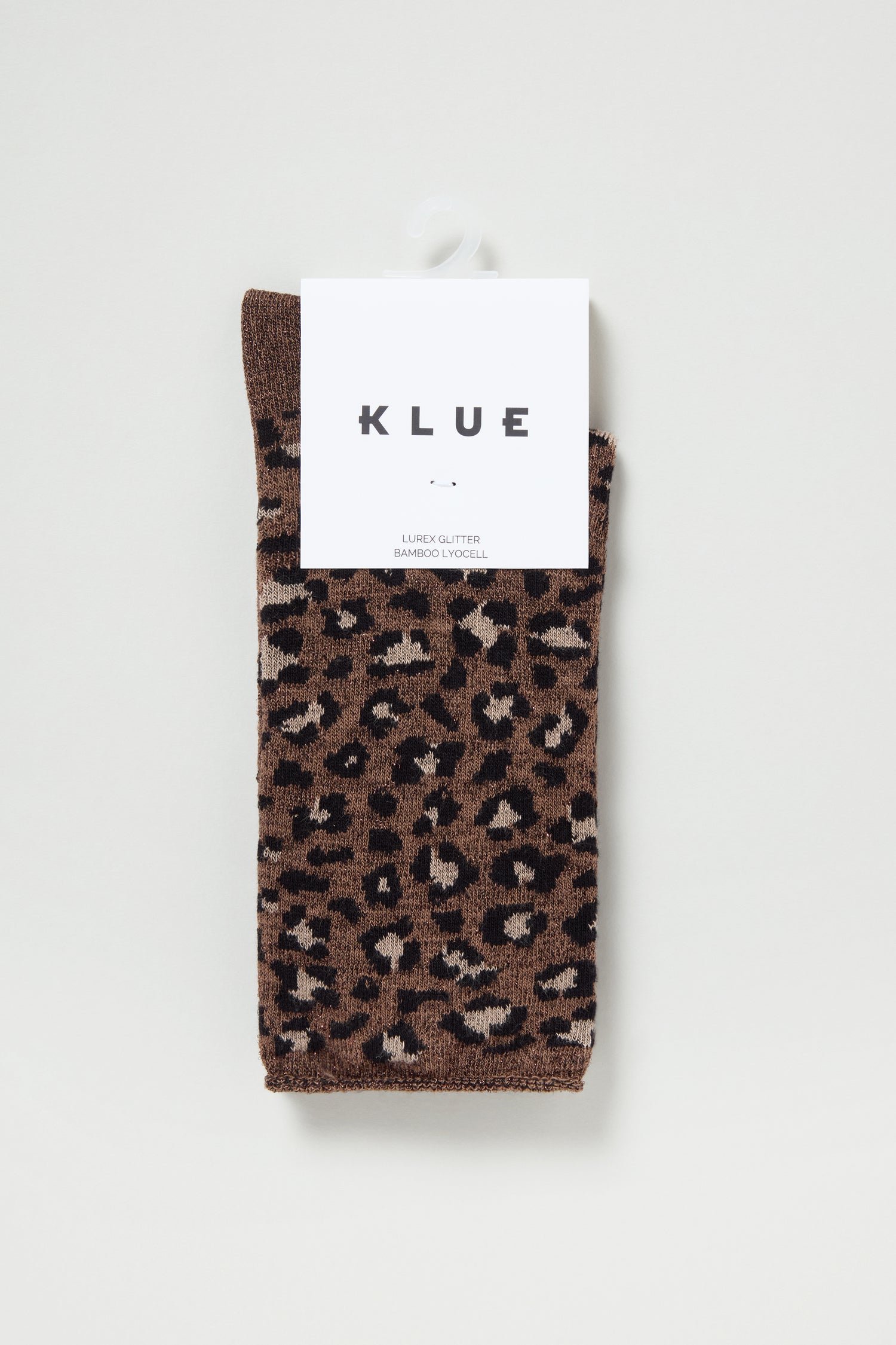 Bamboo Leopard Brown Print Socks, made from sustainable bamboo fabric, are folded neatly with a white KLUE label attached at the top.