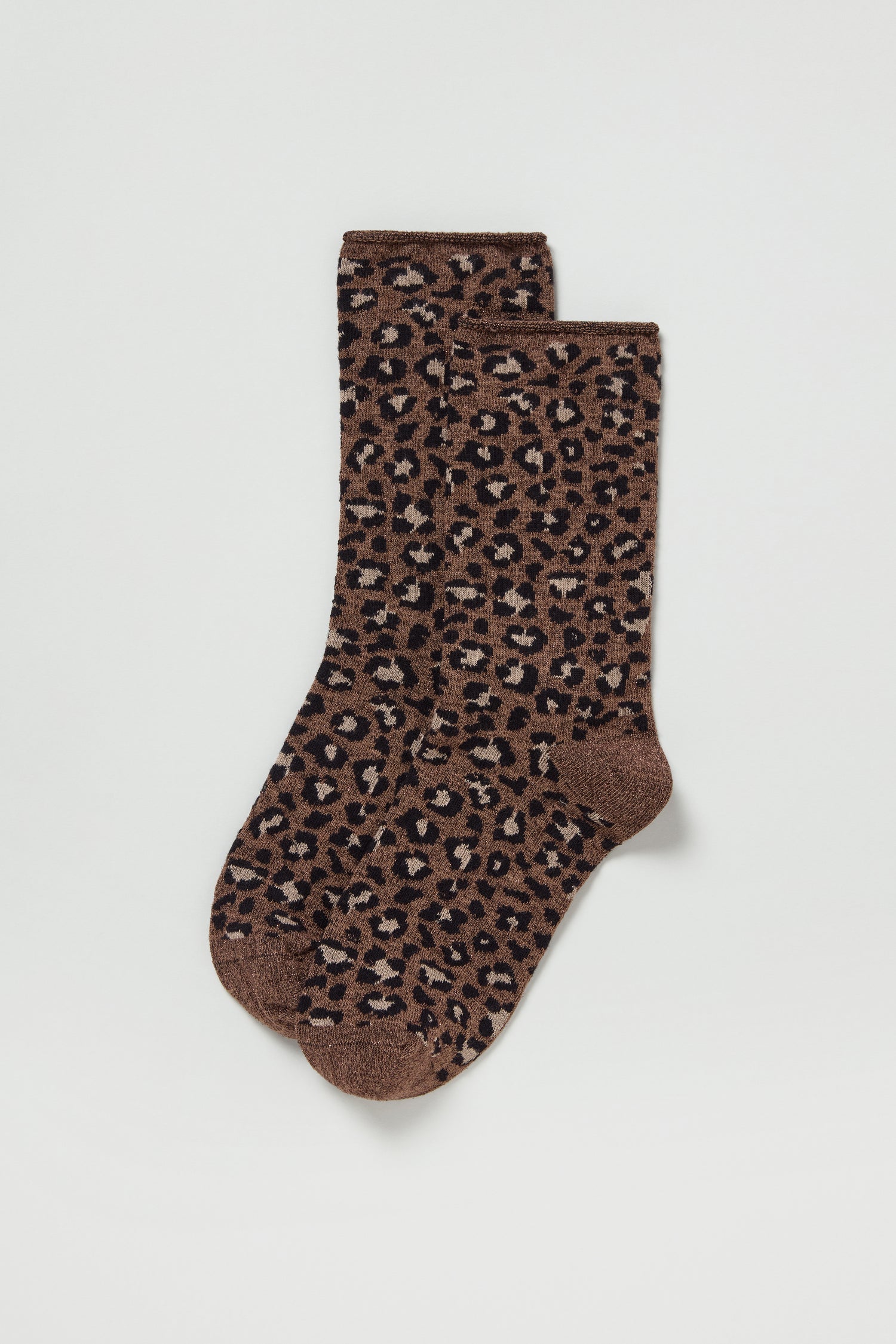 Bamboo Leopard Brown Print Socks featuring a black and beige leopard pattern, laid flat on a white background. These sustainable socks offer wild style with eco-friendly comfort.