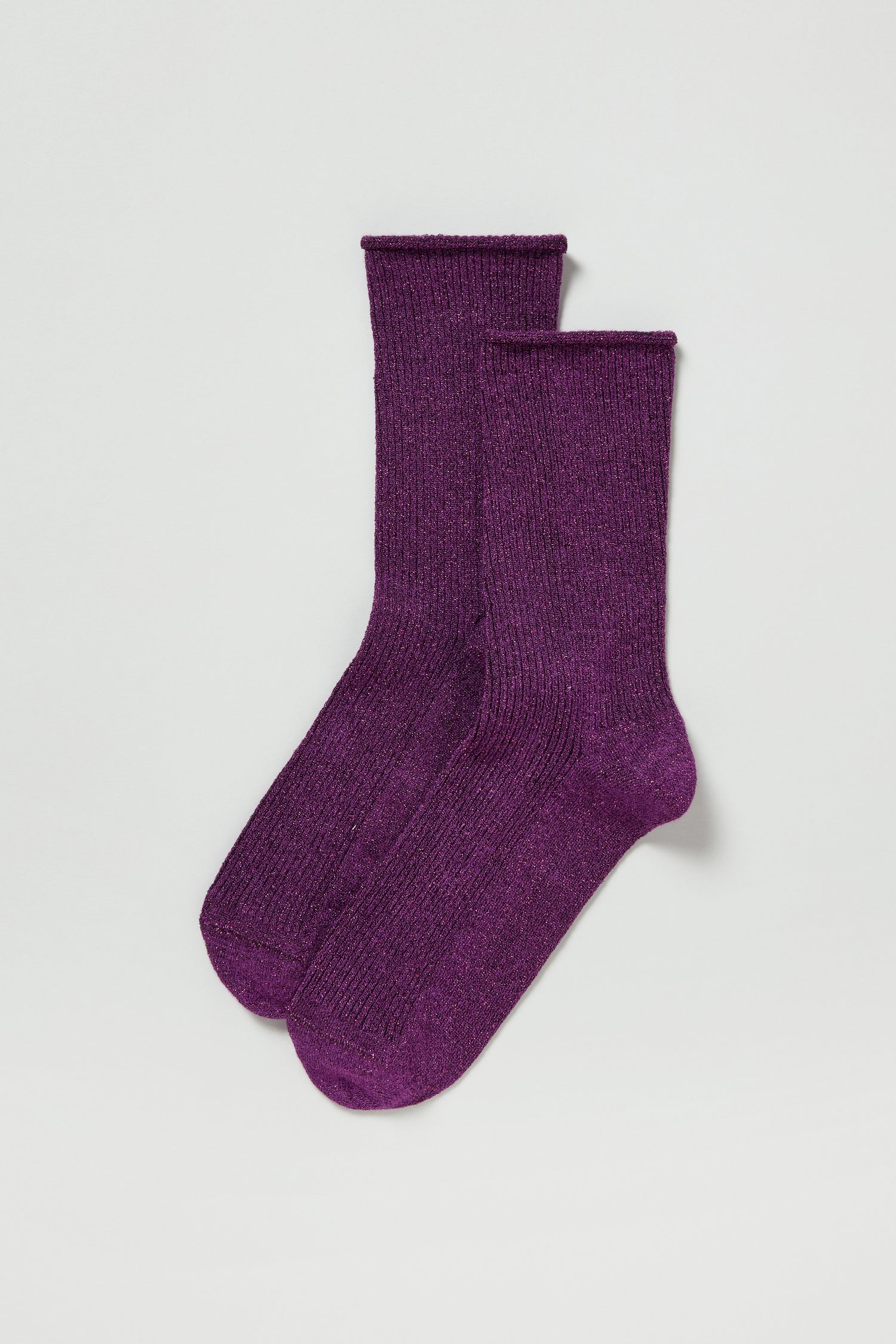 A pair of Bamboo Sparkle Purple Socks, made from soft eco-friendly bamboo, is laid flat on a white background.