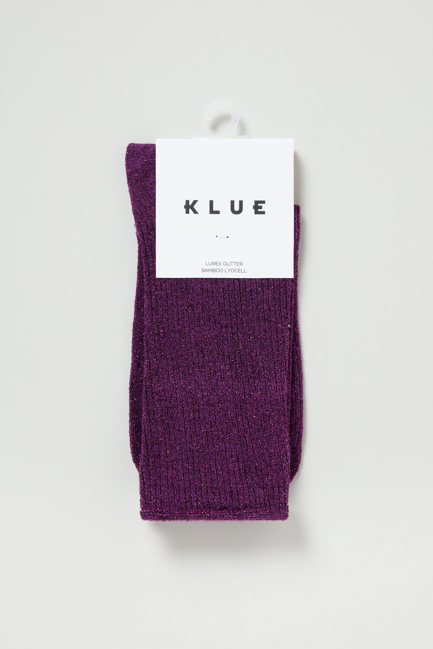 A pair of Bamboo Sparkle Purple Socks featuring eco-friendly purple glitter fabric and a white "KLUE" label, displayed against a plain light background.