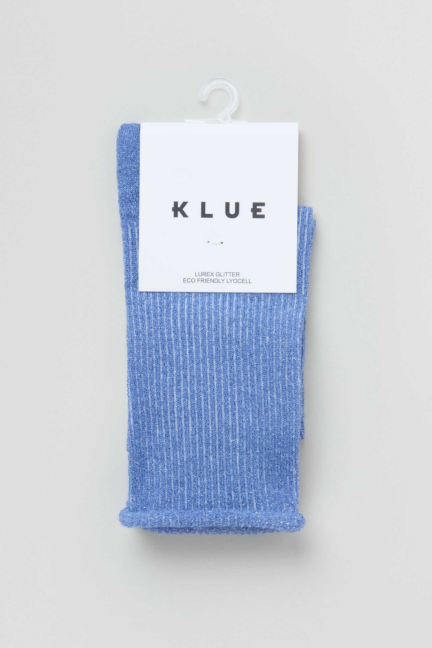 Bamboo Sparkle Blue Socks: blue ribbed socks with glitter and metallic lurex, packaged with a white "KLUE" label and hung on a plastic hook.