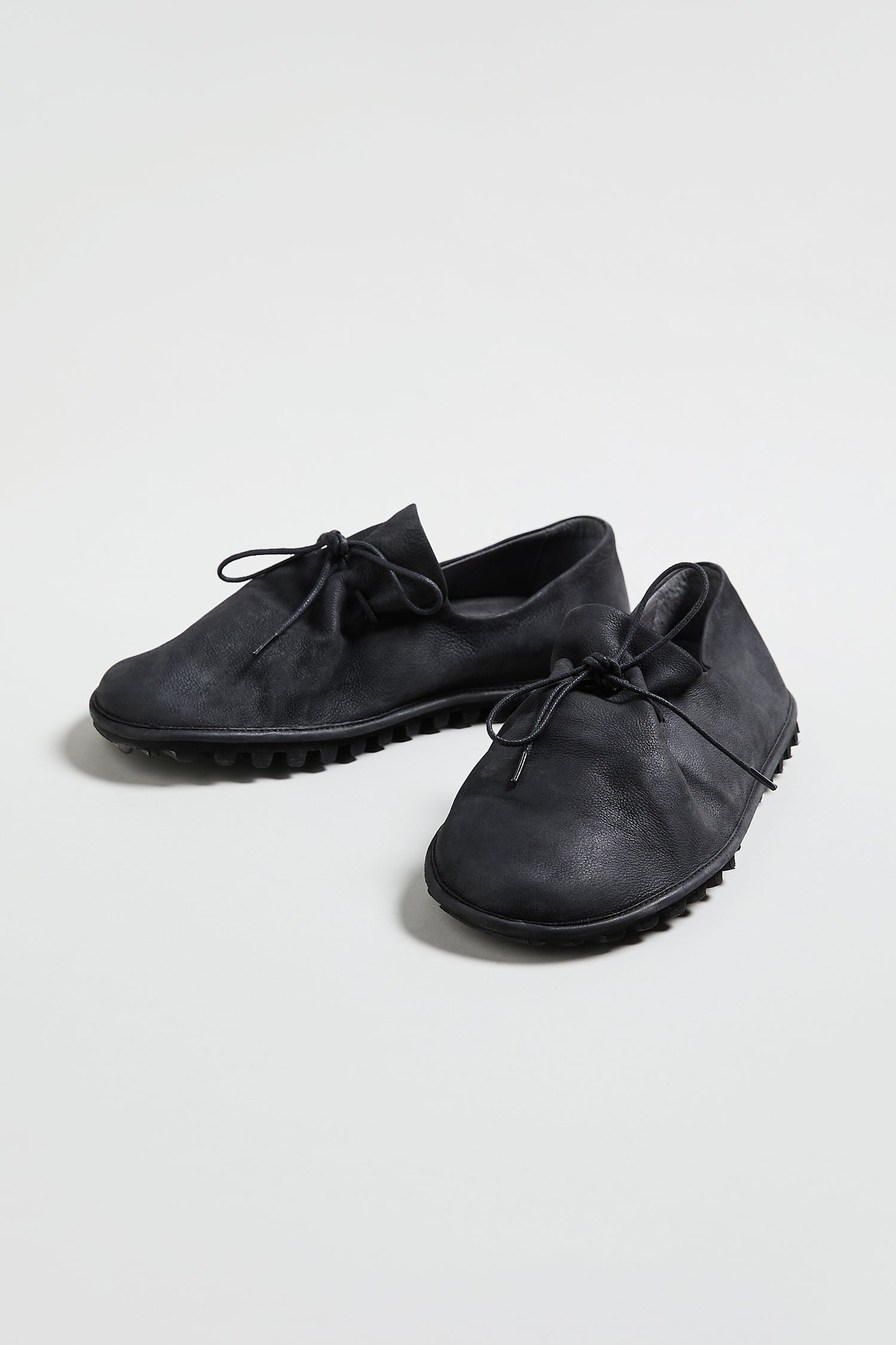 A pair of Crushed Leather Lace Up Shoes, model LOFI9944-SS26, in black with laces and textured rubber soles, displayed on a plain white background.
