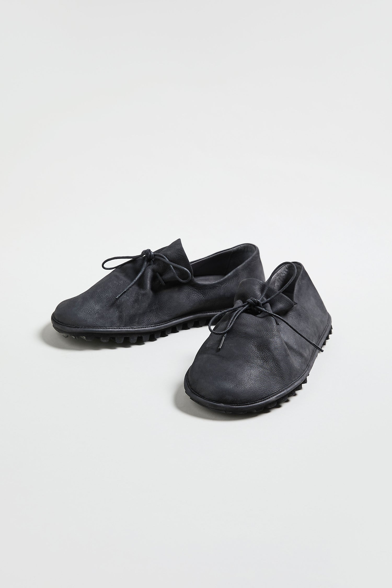 A pair of Crushed Leather Lace up Shoes, handmade in Italy in black leather, displayed against a plain white background.