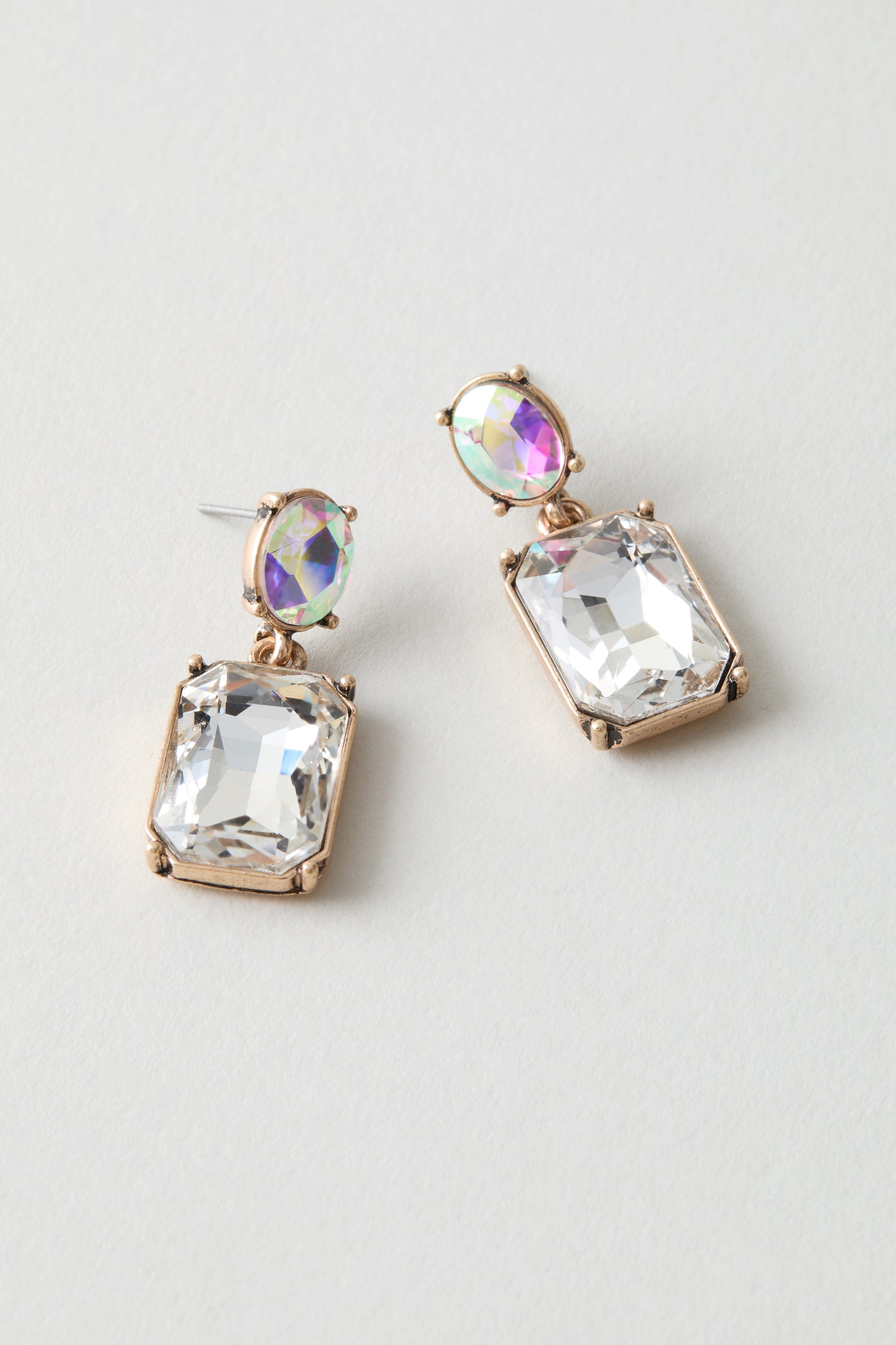 Twin Gemstone Earrings: Gold-framed, modern earrings with rectangular clear gemstones and small iridescent round stones—perfect for a statement on any occasion.