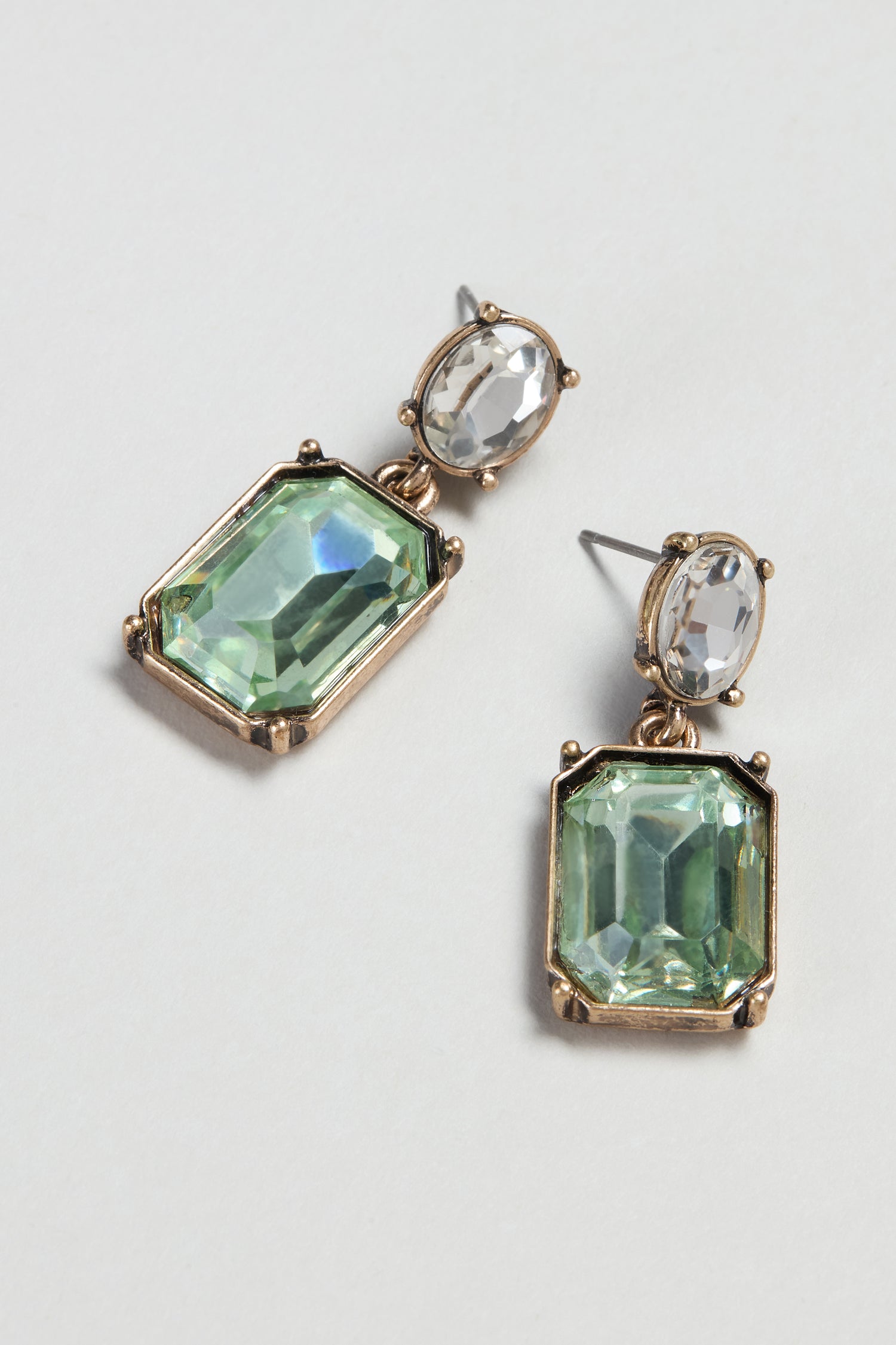 Twin Gemstone Earrings with vibrant green stones offer a modern touch, making them the perfect accessory to enhance any outfit.
