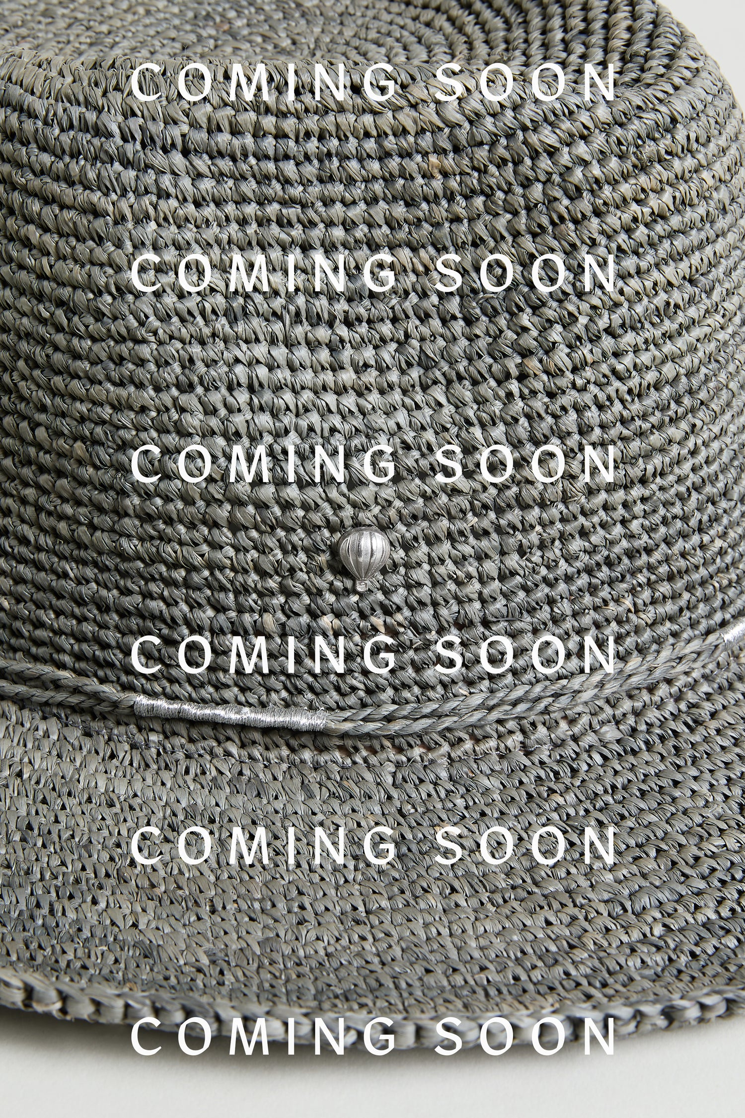 A close-up of the Chapeau Westilux, a woven gray hat, features "COMING SOON" and "SS26" in bold white text across the image.