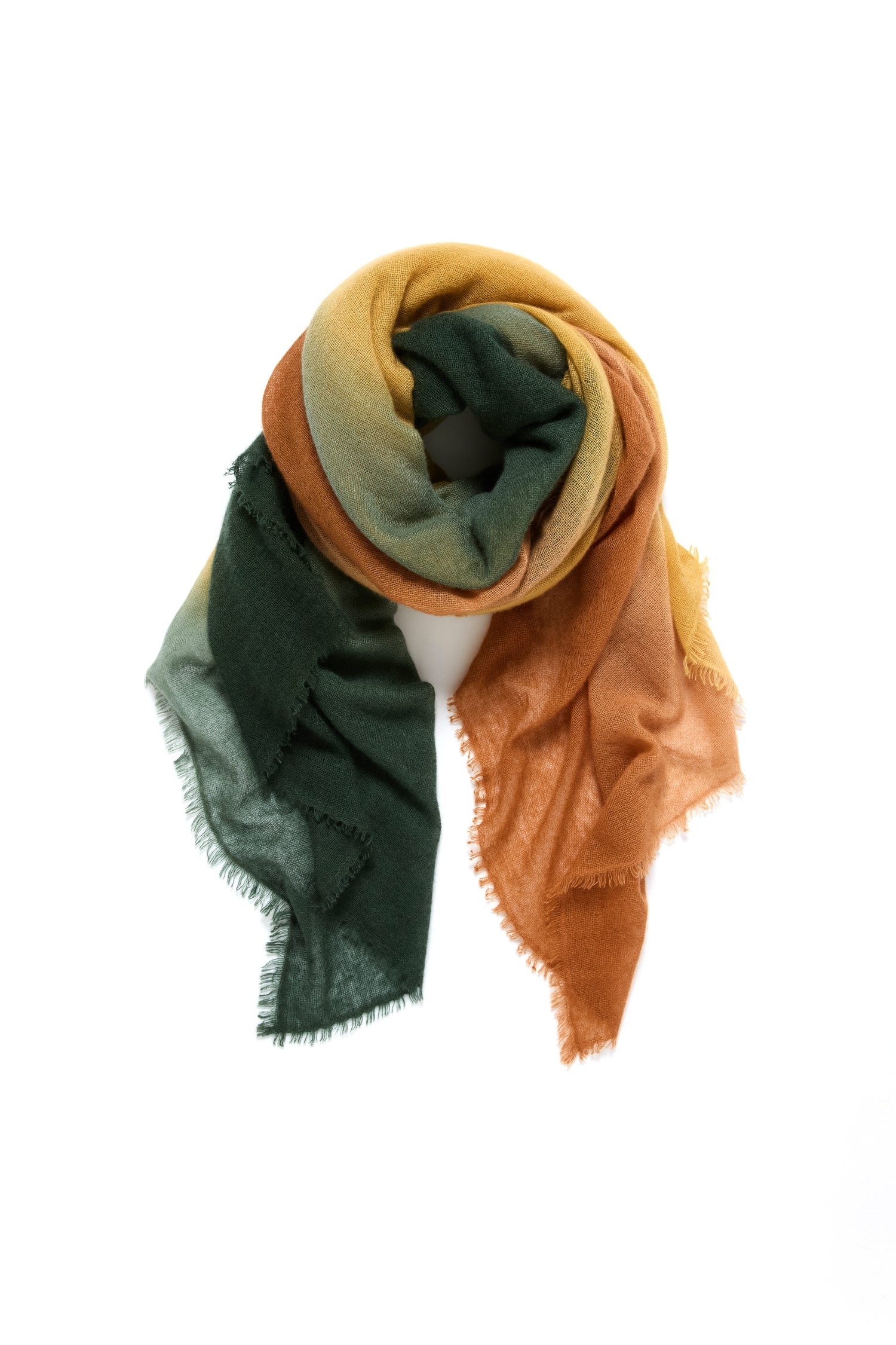 The Soft Colourblend Cashmere Shawl, featuring green, yellow, and orange sections in soft, lightweight cashmere with frayed edges, is displayed against a white background—a timeless multicolored accessory.