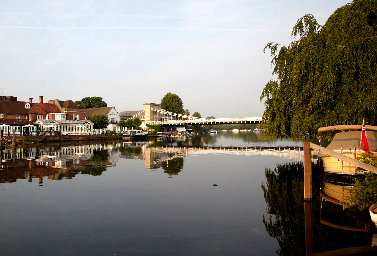 river with buildings next to it and a bridge