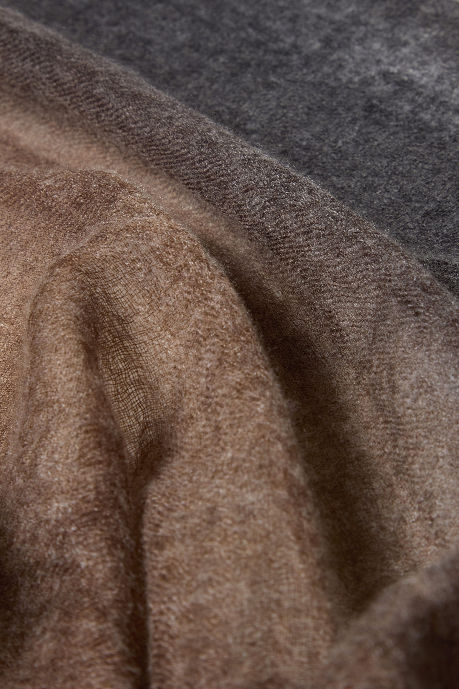 Close-up of the Airbrush Gradient Cashmere Scarf, featuring a soft, sheer blend of brown and gray with subtle texture and gentle folds—a luxury accessory to elevate any look.