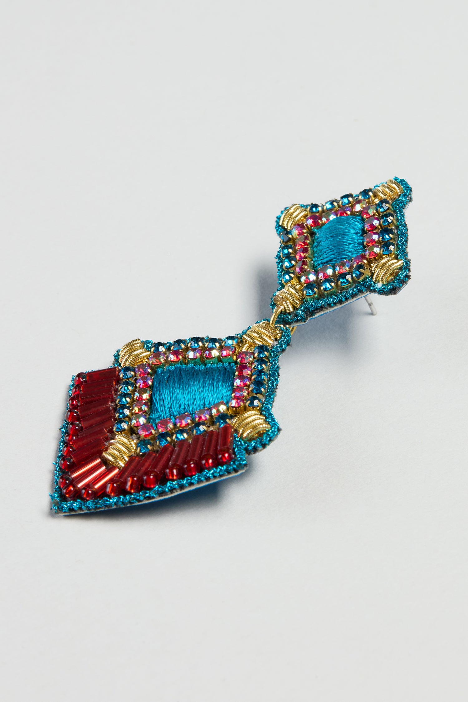 The Hand Embroidered Square Drop Earrings feature diamond-shaped sections adorned with red, blue, pink, and gold thread, beads, and embroidery—perfect for lovers of handcrafted jewelry.