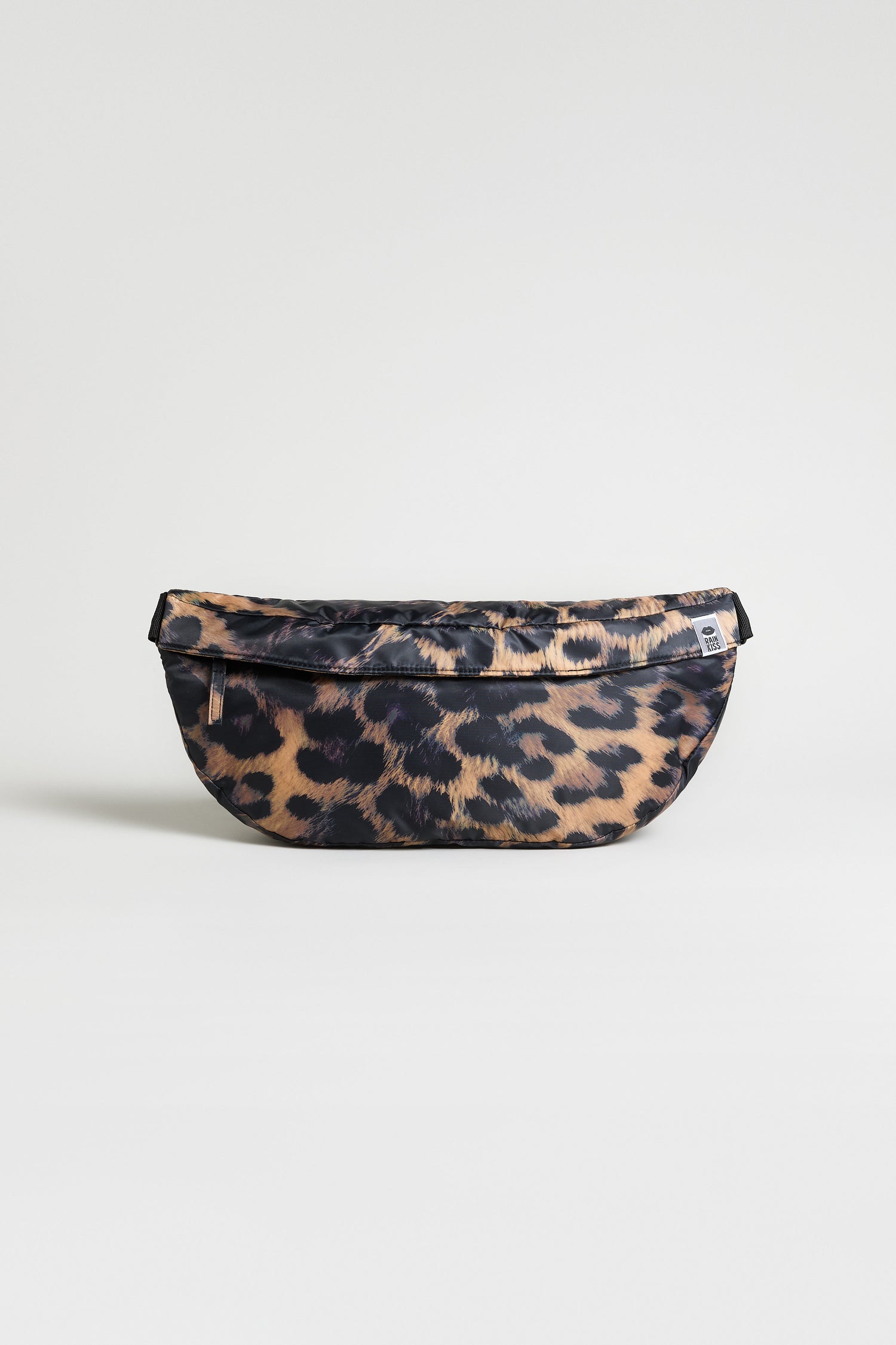 A Dark Leopard Cross Body Bag from Rainkiss with a curved bottom is displayed on a plain, light background.