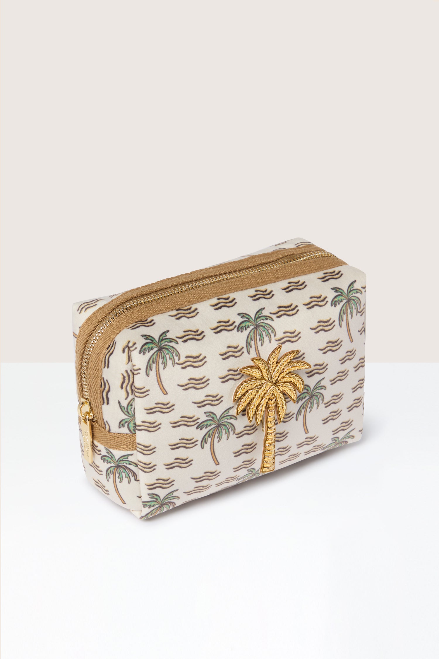 The Large Palm Make-Up Bag embodies tropical elegance with its rectangular shape, golden zipper, and design of green and gold palm trees set against a beige background adorned with wavy brown lines.