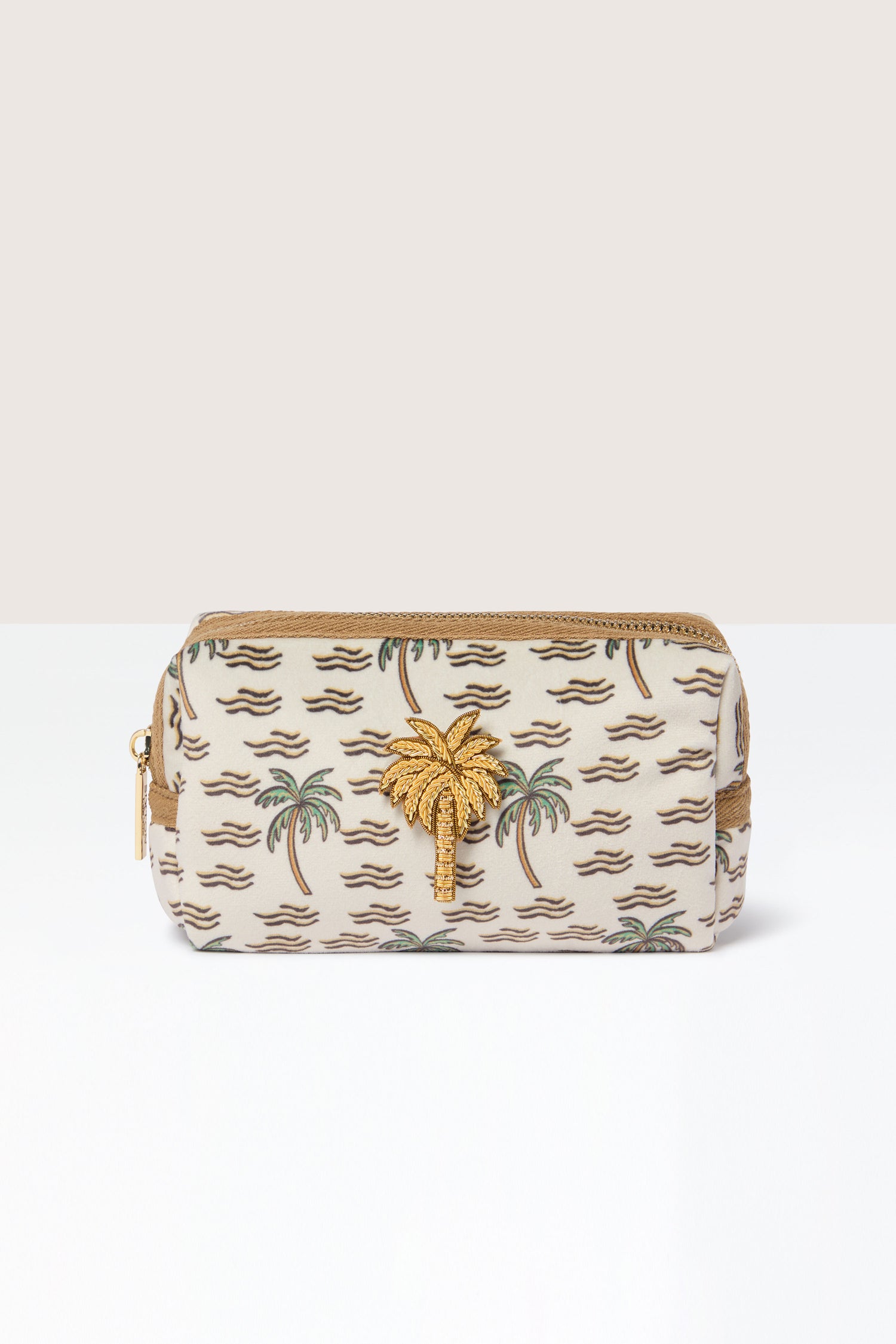 The Small Palm Make-up Bag is a beige zippered pouch featuring elegant palm tree patterns and an ornamental gold palm tree on the front. It's perfect for holding your beauty essentials and exudes tropical vibes.